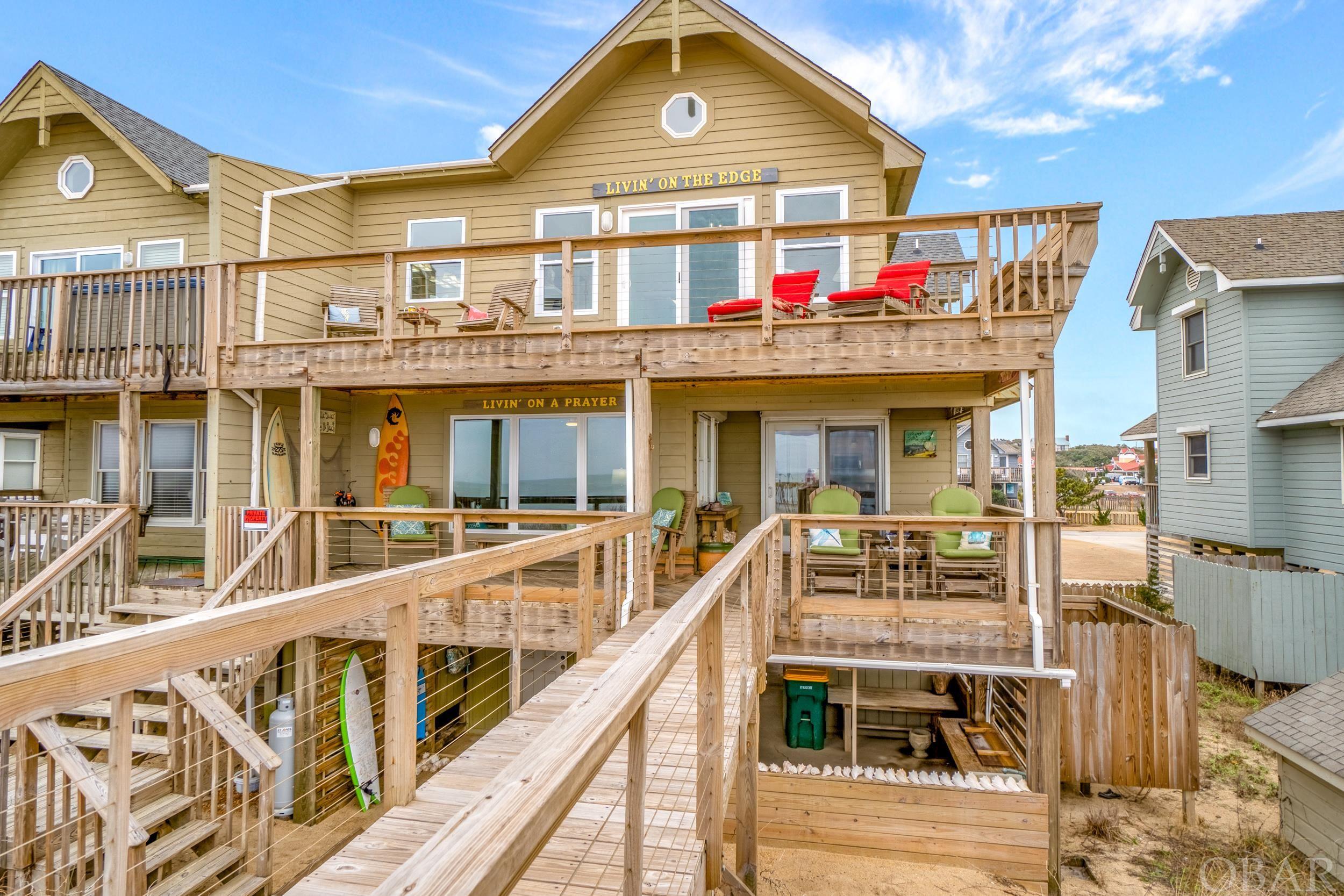 open house Saturday 10-3 AND Sunday 11-4  OCEANFRONT!! Arguably the BEST location in the Outer Banks.  Southern Shores is your first hamlet when taking Ocean Blvd. towards Duck and Corolla.  Stunning 4 bedroom 3.5 bath 2340 sq. ft. townhome style condo. This owner occupied home has been masterfully updated with nothing but high end appointments. Kitchen offers leathered granite countertops, soft close cabinets, luxury stainless kitchen Aid appliances, tiled backsplash, pantry, breakfast bar.  Kitchen and dining face east to enjoy your ocean views. The family rooms  palatial oceanfront windows, wine fridge, and granite gas fireplace make this home STAYCATION worthy.  Private "cable railing" beach walkway installed 2018, roof 2019, HVAC 2021, 80 gal. hot water heater, 2018. New windows. Master bedroom struts an unobstructed view of the Atlantic Ocean, vaulted ceiling, and skylight with remote shade.  The master bath with a free standing soaking tub, double vanity, new cabinets, built in make up counter, and walk in tiled shower make this master en-suite showroom ready! Bedrooms 2-4 are spacious most with closet built-ins. New LVP floors throughout the home creates an open air feel. LED lights throughout, numerous closets, new paint, 2 outside secured storage 8X8 AND 4X8, a full workshop, cleaning station with sink, outdoor shower, and 3 decks to enjoy the ocean air. Attention to detail under pinning, blinds throughout, and a home inspection make this home turn key ready.  Optional Southern Shores Civic Association included 3 marinas, beach access, playgrounds and tennis court, soccer field, basketball half court and walking trails. Summer 2022 beach replenishment approved. Pelican Watch is Southern Shores' only OCEANFRONT townhome community, is just north of the iconic Kitty Hawk Pier,  and equidistant from Corolla beaches to Nags Head making it the perfect location. Oh and the sunrises...... simply sublime.   Your watch for the perfect oceanfront home ends here at Pelican Watch!