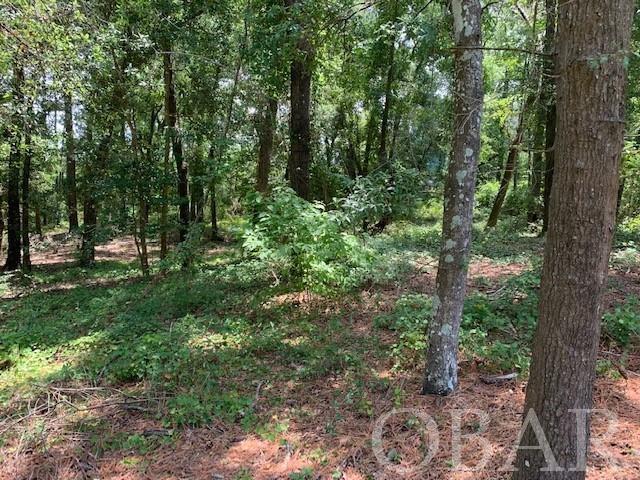Great location to build your dream home nestled on a nice wooded lot with plenty of privacy in the quiet neighborhood of Sunrise Crossing! An outdoors enthusiast's joy to have access to kayaking, you are within walking distance to the community boardwalk and dock for sound access. Community adheres to strict architectural guidelines for copacetic features to be offered. Located only minutes to the beach this lot is large enough to support a pool for additional enjoyment.