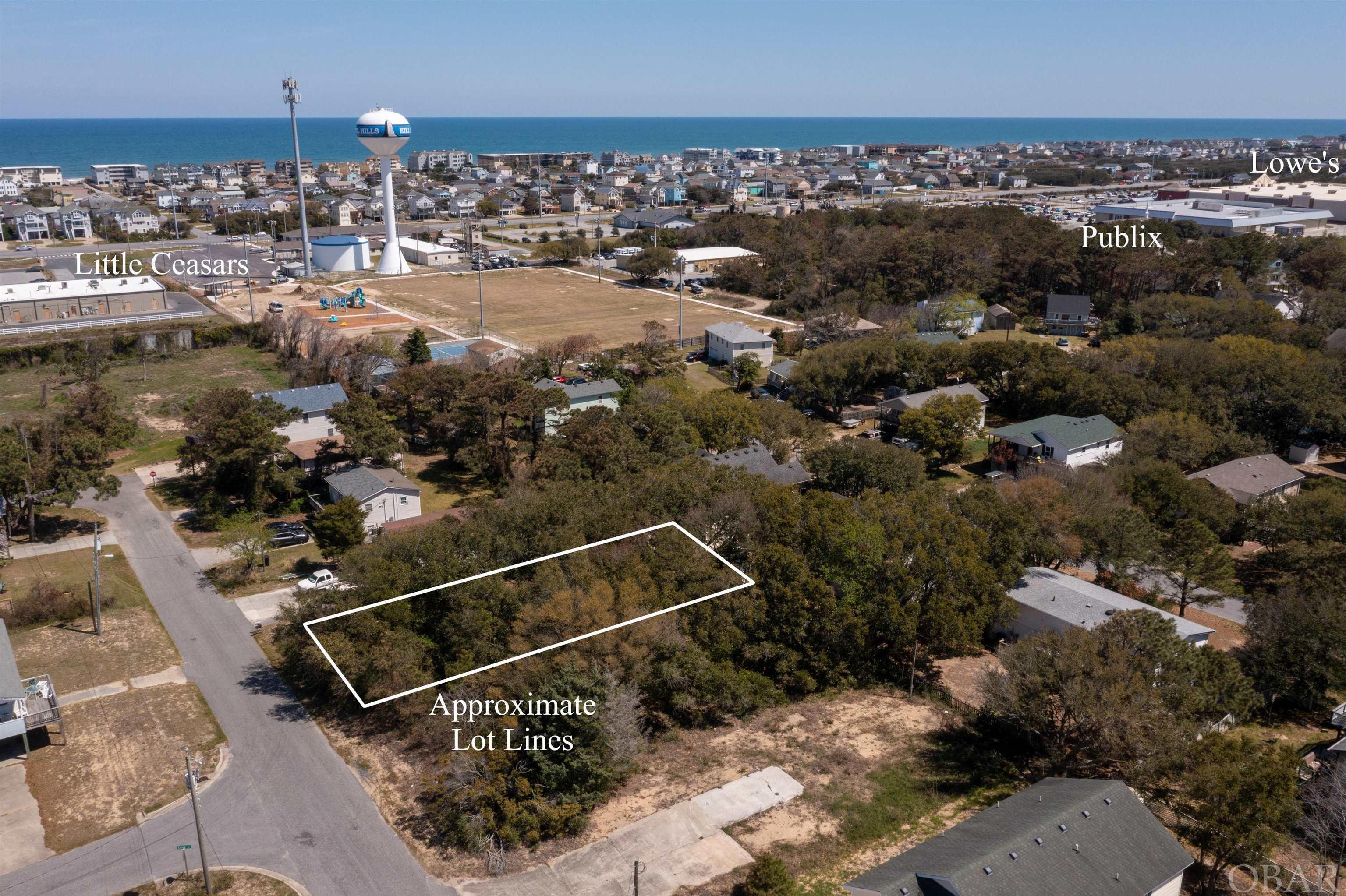 A Sweet Lot with high elevations located close to all of the amenities Kill Devil Hills is so well known for. This West Side lot offers opportunity with X Flood Zone and No Fill Required. With multiple Beach Access options directly across the Stop Light and the Sound Access at the end of Third that blends into the Bay Drive Multi Use path for miles of enjoyment along the sound. A winning combination. The Sound access for launching your boat is at Dock Street just quick bike or car ride away. Located in a private setting but also close to Publix, Food Lion, Lowes, and the upcoming Target, this is a no brainer. Call me today to discuss your options. Lot directly next door is also available for sale. Property taxes are estimated using 2021 tax rate and the asking price. Actual taxes will be determined upon separation of lots by the county.