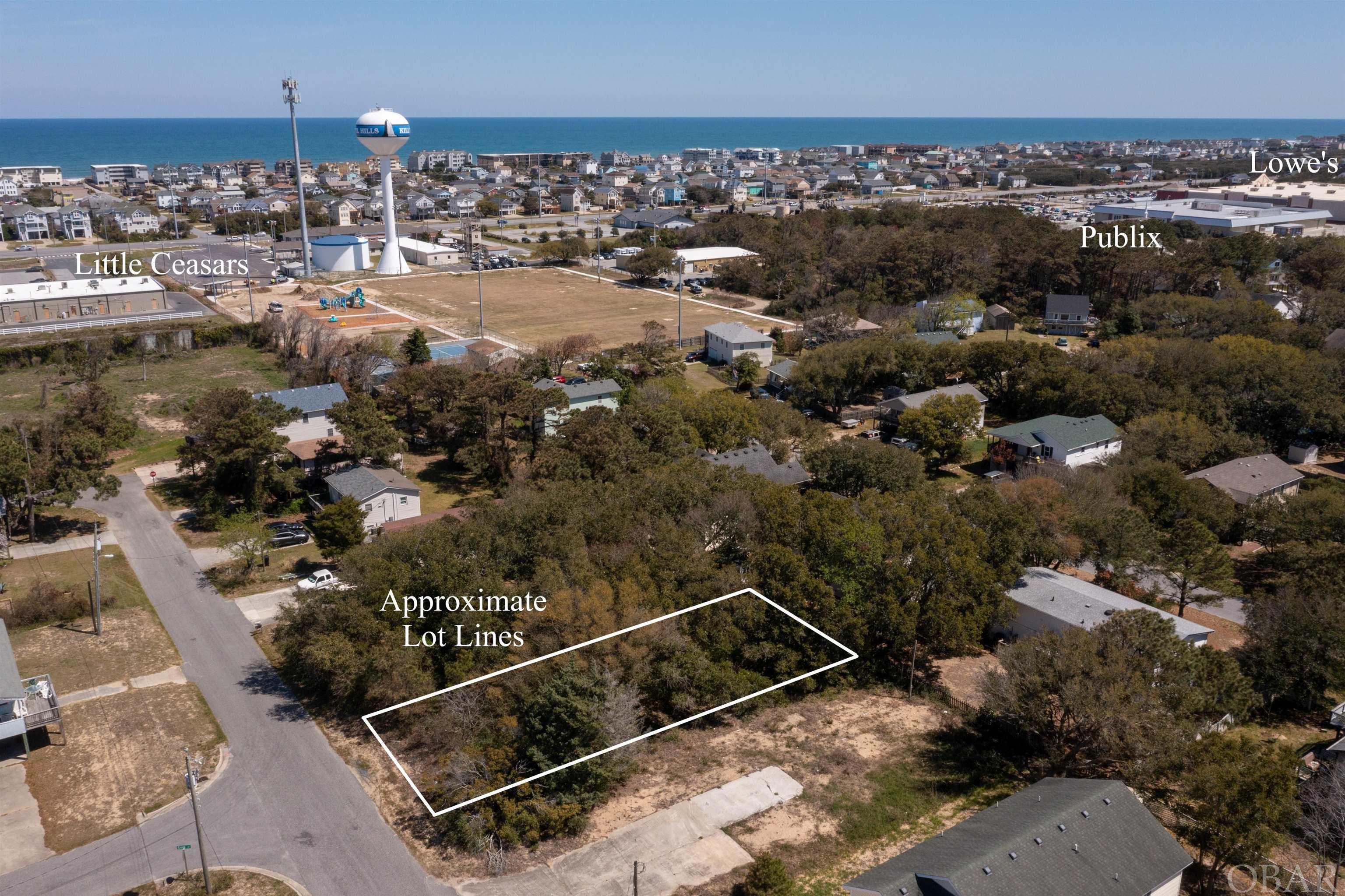 A Sweet Lot with high elevations located close to all of the amenities Kill Devil Hills is so well known for. This West Side lot offers opportunity with X Flood Zone and No Fill Required. With multiple Beach Access options directly across the Stop Light and the Sound Access at the end of Third that blends into the Bay Drive Multi Use path for miles of enjoyment along the sound. A winning combination. The Sound access for launching your boat is at Dock Street just quick bike or car ride away. Located in a private setting but also close to Publix, Food Lion, Lowes, and the upcoming Target, this is a no brainer. Call me today to discuss your options. Lot directly next door is also available for sale. Property taxes are estimated using 2021 tax rate and the asking price. Actual taxes will be determined upon separation of lots by the county.