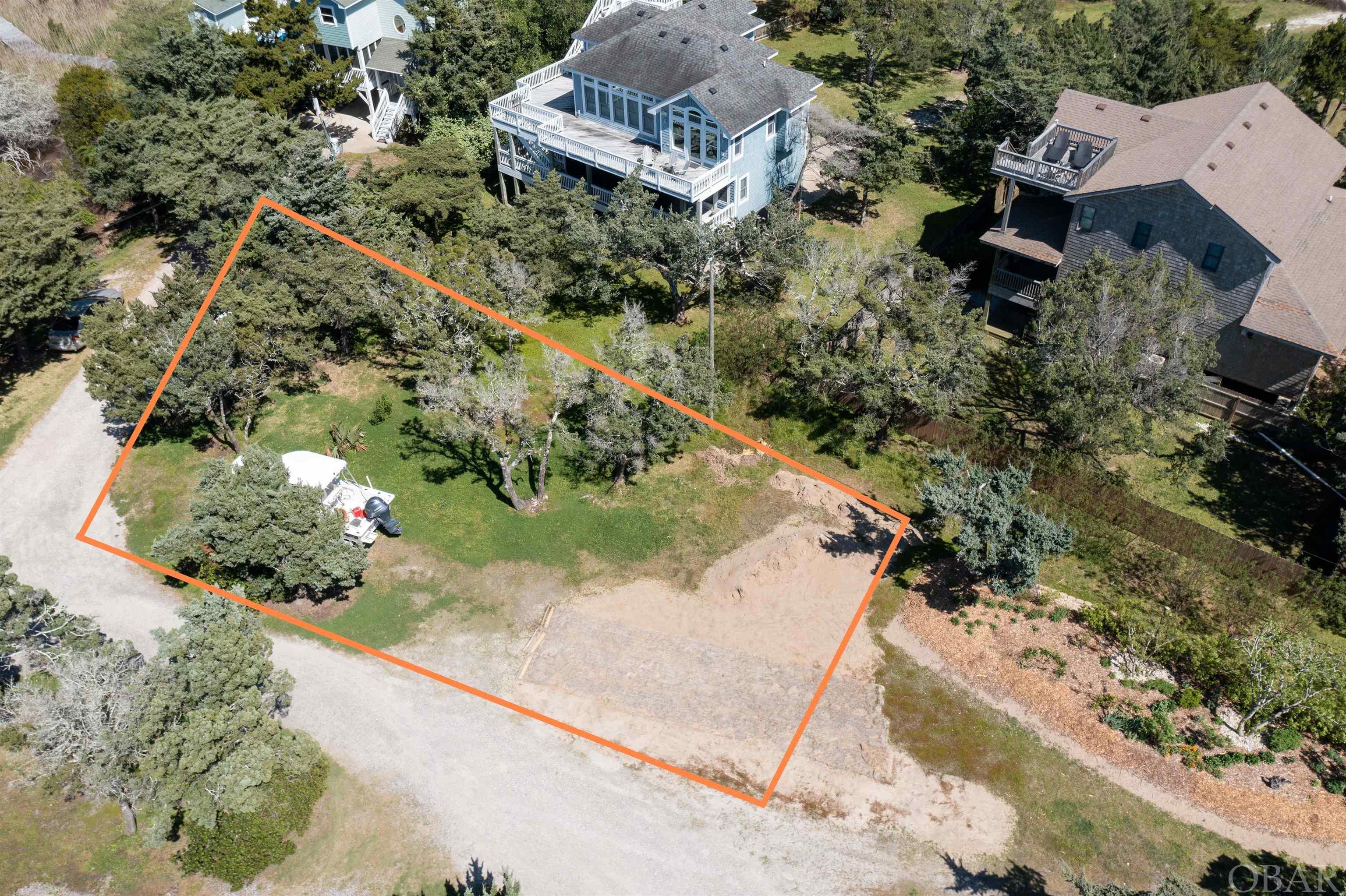 This serene hideaway is a rare Ocracoke lot ready for your new home. Enjoy secluded sound and marsh views at the end of a quiet, peaceful road. The large lot of over 7,050 sq ft provides ample room to maintain mature cedars. 3 bedroom septic permit on file.