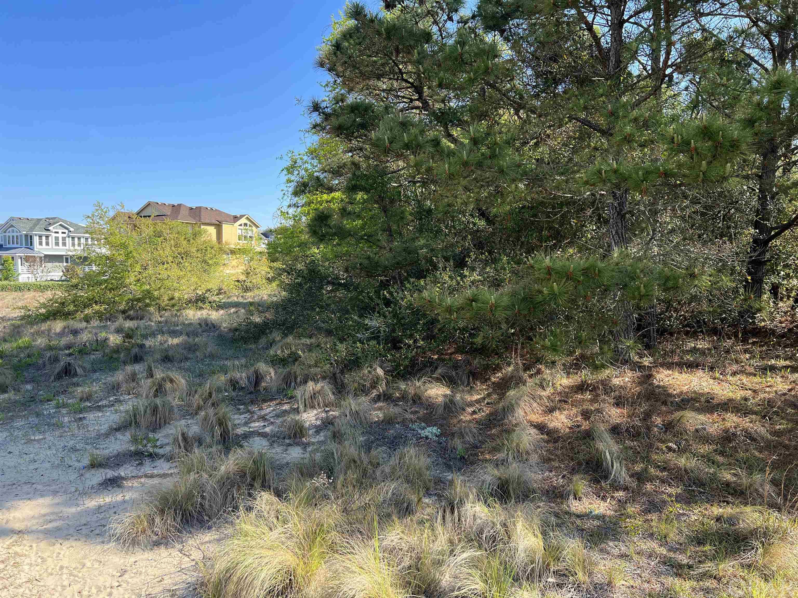 This is the lot you have been waiting for. This 15,000 square foot lot is located in one of the nicest subdivisions in Kitty Hawk. The lot is in an X flood zone and might have water views from a 2 story house. There is plenty of room for a pool or the subdivision has a large community pool for all to enjoy. There is a little playground and park for the younger children to enjoy. Ride by and take a look at his lot and all the nice homes in Harbour Bay. Perfect spot for a year round home or build a home and take advantage of good rental potential.