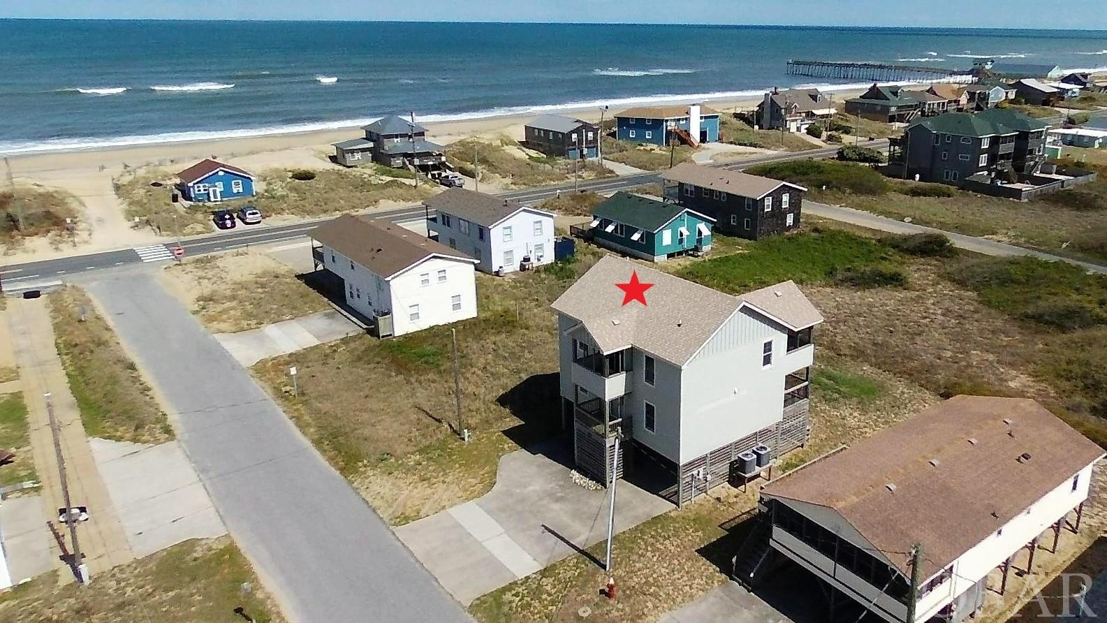 Multiple offers have been received.  All additional offers are requested to be submitted by noon on Tuesday May 3rd. Location, location, location.  This property located just 2 lots from the oceanfront is less than a minute walk to the beach.  The 3 bedroom, 3 bathroom house built in 2010 is the perfect 2nd home or investment short term rental on the beach. The layout is well thought out so that your family and guests will always have a space to relax in.  The first floor with dry entry has 2 master bedrooms on the oceanside of the house.  The West side of the house has a bedroom and an office/media room with a shared bathroom between the two rooms.  On the first floor you have front and back decks to enjoy the ocean breezes and salt air.  The back deck is prewired, reinforced and ready to add the hot tub of your choice.  The top side of the house offers spectacular ocean views from both the interior and decks.  The kitchen and dining area are located on the oceanside of the house, the vaulted ceiling and ocean views make this a great gathering spot for family and friends..  There is a living/family room located on the West side of the upstairs.  The sliding door from the living room leads out to the screened porch with picnic bench for outdoor dining.  The deck then extends towards the ocean and becomes a sundeck, great for after beach drinks or enjoying the sunrise over the ocean. There is also a front deck upstairs to enjoy the views from as well.  Upstairs is finished off with a half bathroom and large storage area/pantry that can double as an owner's lockup closet if needed.  The outdoor space of this house also has a lot to offer.  There is a large 14' X 8' dry storage under the house that can house all your beach and yard toys as well as an extra refrigerator for beach beverages.  Under the house you will also find the outdoor shower and another picnic bench for snacking and dining after the beach.  The backyard is a great space that would easily accommodate a fire pit, volleyball or bocce court.  Schedule your tour today and don't miss out on this opportunity to own on the Outer Banks.