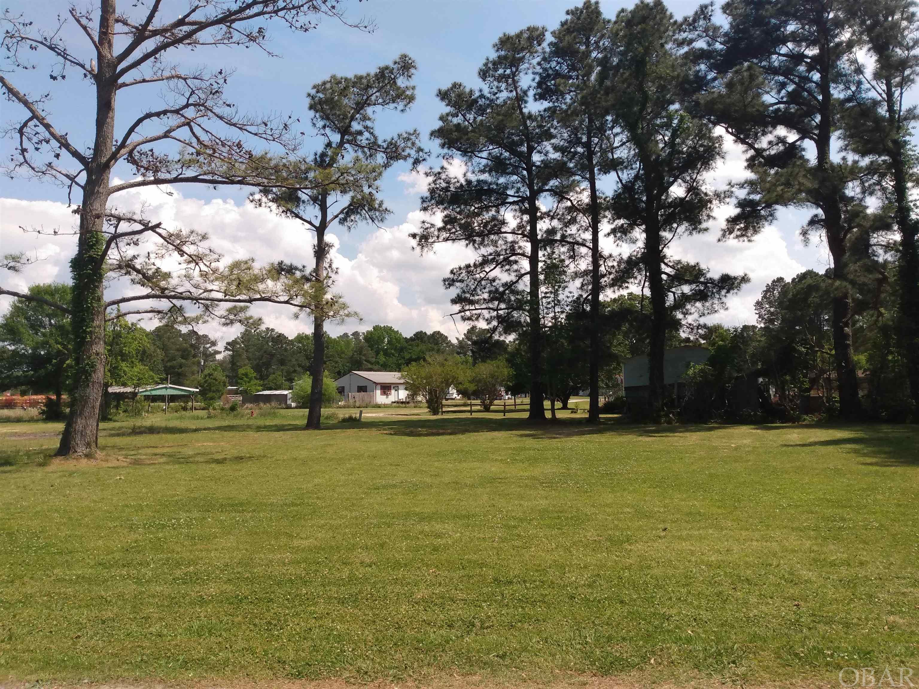 Cleared one- third acre vacant lot at "Taylors Beach," in Tyrrell County, N.C. No restrictions. Seller has a membership in the "Taylor Beach Club" of which the membership may be transferable to the buyer. The membership allows access to the club boat ramp, the pier extending into the Albemarle Sound and the beach house! Municipal water is available at the street and there is an existing septic system on the property. Low property taxes! Ideal property for a vacation home and entertaining family and guests! Offered at $30,000.