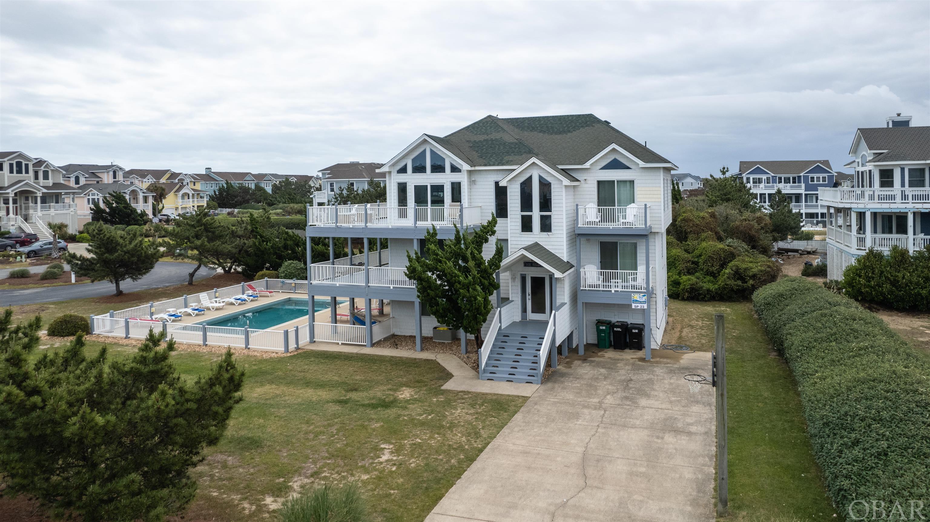 Spectacular opportunity for this semi-oceanfront home in Duck!  The home features a great layout with plenty of space for your family to spread out and enjoy all that the beach has to offer.  Expansive decking, awesome pool area, great ground floor game room, open and spacious top floor for family gatherings and meal time.  The bedrooms are good sized.  Right in the heart of Duck on arguably the best street in town, you can walk right over to the beach for the day or down to the shopping and restaurants.  You can't beat this great opportunity!