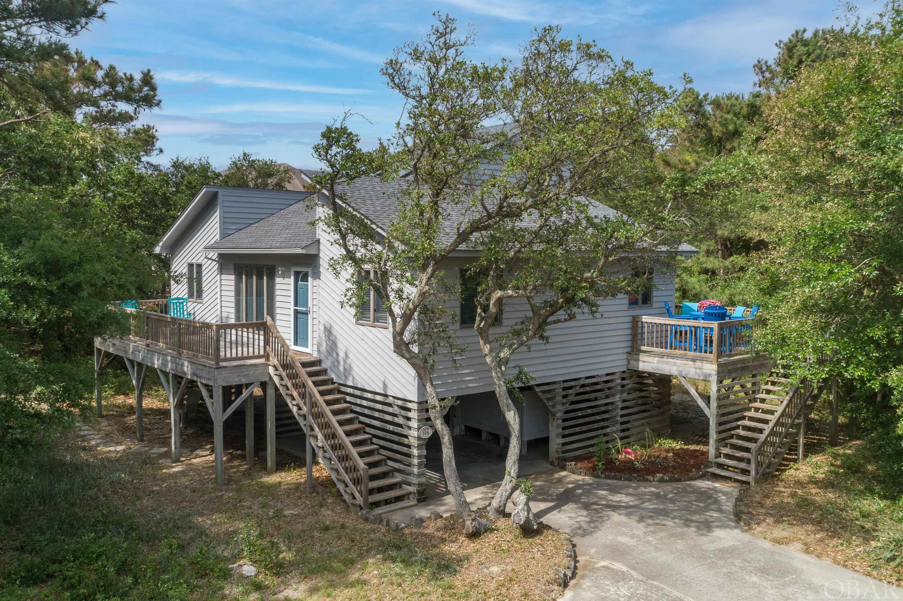 This Chicahauk home is just a 5 minute walk to the beach and located on a private 26,872 square foot lot in an X flood zone. The interior is freshly painted and new flooring to compliment the natural light pouring in the large windows. There is a screened porch, 2 decks perfect for outdoor entertaining. Under the house you will find storage for bikes, boards and beach chairs. Sellers have provided a recent survey to get you started! Chicahauk POA provides a great park with tennis courts, basketball and a baseball field. This beach house is waiting for a creative mind to transform the property into a Southern Shores oasis.