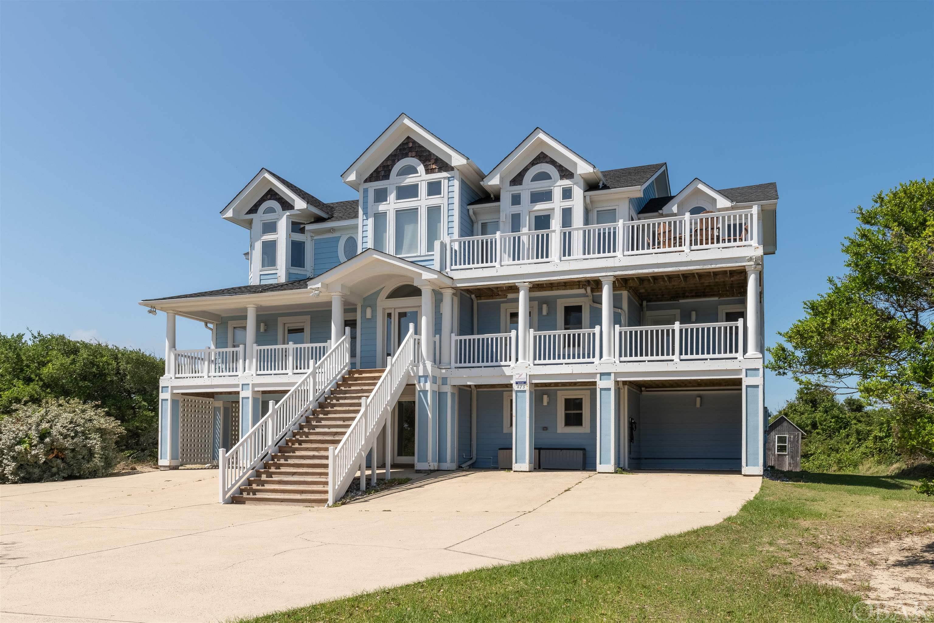 Outstanding location on nearly one acre with panoramic ocean views and 8 suites!  Fully handicap accessible with handicap friendly bedroom on the mid-level complete with roll in shower.  Only 3 lots back from the beach!  A very short stroll to uncrowded beaches, private pool, hot tub, game room with exercise area & kitchenette, mid level media room, top level master bedroom with fireplace & jetted tub, elevator, large and open great room featuring cathedral ceilings with lots of windows to enjoy the outstanding ocean views, tiled entry foyer, amazing kitchen with 2 of each appliance, hardwood floors, spacious bedrooms, mid level media/family room, ground level recreation room, gated community, subdivision tennis courts, close to shops, restaurants & the Currituck Club Golf course.  It simply doesn't get any better!  Lots of recent improvements.......New roof in 2020, new ground level HVAC 2020, New top level HVAC 2019, mid level HVAC replaced in 2012.  New vinyl handrails on decks in late 2020.  New pool fence late 2020.  New front stairs with vinyl handrails early 2021.  All north facing siding on house was replaced and painted in late 2020.  New living room sectional sofa late 2020.  New dining table in late 2020.  New furniture in mid level family room late 2020. All new window treatments 2022. New pool heather and saltwater system 2022.  New Charge Point Cart Charger 2022. High end and durable, composite pool furniture.