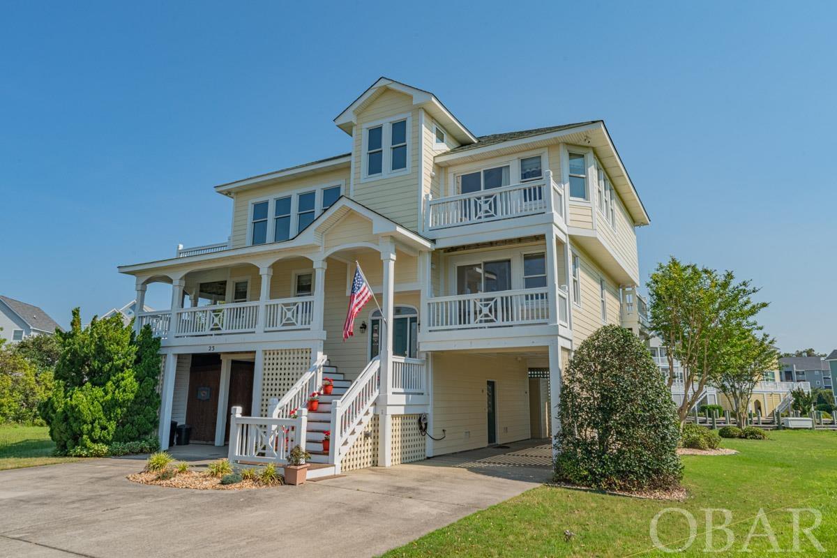 Enjoy this primary owned home in meticulous condition. This 4 bed (2 ensuites), 3 bath, 3,516 sqft home is exactly what you are looking for in the coveted community of Pirates Cove. This 8,000 sq ft. lot extends to the canal featuring 150' of water frontage. Walk into a home full of natural light with a wall of windows in the great room. Move over to the kitchen where you will find a large amount of cabinet and countertop space, along with bar seating, perfect for entertaining. The 2 large ensuites are equipped with a walk-in closets and large master bath with jet tub. The other 2 bedrooms are equally as spacious. You will not miss the chance to spend time lounging outside enjoying the sunsets on one of the multiple decks. The two large decks on the back of the home are accessible via outside staircase from the ground floor to the top floor. On the ground floor you will find the large workshop area, along with 2 additional storage closets. Outside you will find two large carports and a hook up for an outside shower. This spacious home does not lack for storage. In one carport you will find a large exterior storage facility, while behind the home will find an additional storage facility currently used for fishing equipment, surfboards, and other beach amenities. Boat lovers will enjoy the personal 55' boat dock with water and electric hookup directly behind property. Improvements include: Sherwin Williams 25 year Exterior and Interior paint in 2021, New Dishwasher 2021, Wood Floor in den area, and Newer installed 30-year roof. The Enjoy the privacy of the 24/7 gated community of Pirates Cove along with a clubhouse and pool, lighted tennis courts, playground, volleyball court, basketball court, fitness center, community pavilion and miles of lighted docks. Don't forget to stop by Blue Water Grill & Raw Bar located in Pirates Cove Marina for a delicious meal and beautiful sunset!