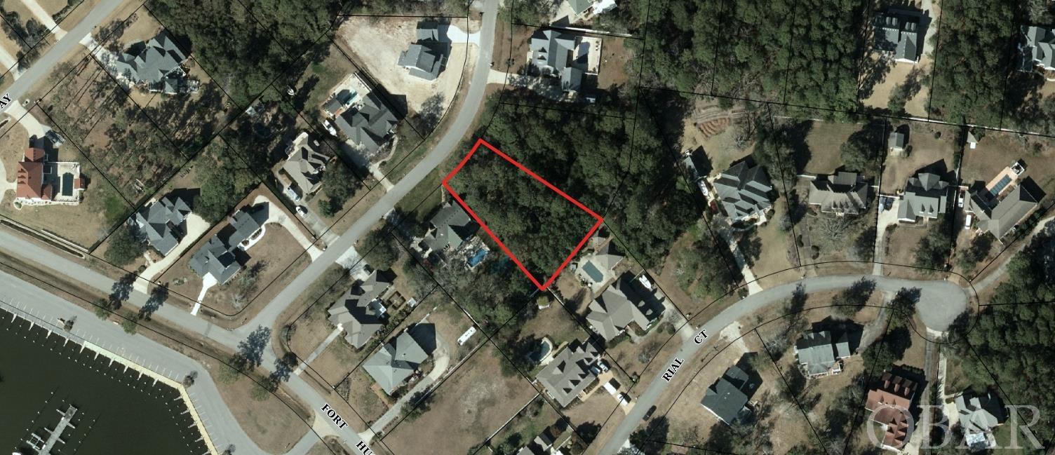 This lot in Heritage Point is located next to the Old Manns Harbor Bridge and close enough to enjoy the activity of downtown Manteo and the beaches, yet far enough away to appreciate the peacefulness of this area. The subdivision offers a marina, boardwalk, tennis courts, club house and sound access.