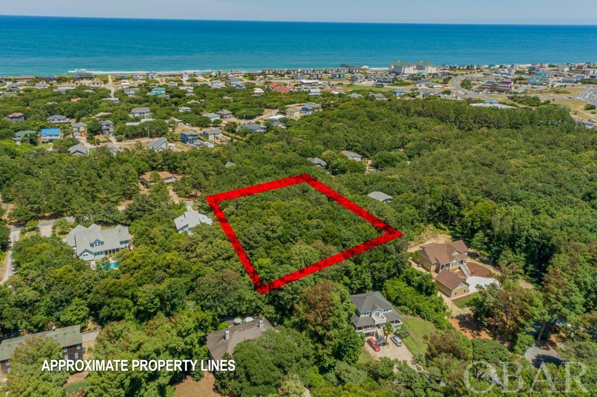 Beautiful and Tranquil Homesite! Large, square lot in the highly desirable Chicahauk subdivision! X flood zone with elevated topography! Over 29,000 square feet. There is a pathway from Wild Pony/Spindrift to Skyline Rd that allows for a casual 0.5 mile walk to the ocean. If you are looking for a quiet and peaceful lot that is also within walking distance to the ocean, this property is for you. A great opportunity to build your primary home, second home, or rental property! Serene views of the ocean should be available depending on your desired floor plan. Conveniently located only minutes away from the finest restaurants and local attractions of Duck, Southern Shores, and Kitty Hawk. Join the Southern Shores Civic Association to have access to all 33 beach access walkways and dune crossovers in Southern Shores, the Hillcrest Drive beach parking area, three marinas: North Marina, South Marina & Loblolly Marina, tennis courts, playgrounds, and numerous natural open green spaces. SSCA dues are $65 for residents and second home owners, and $95 for rental property owners, annually. A great value for your money! Boat Club and Tennis Club memberships are an additional $25 each.