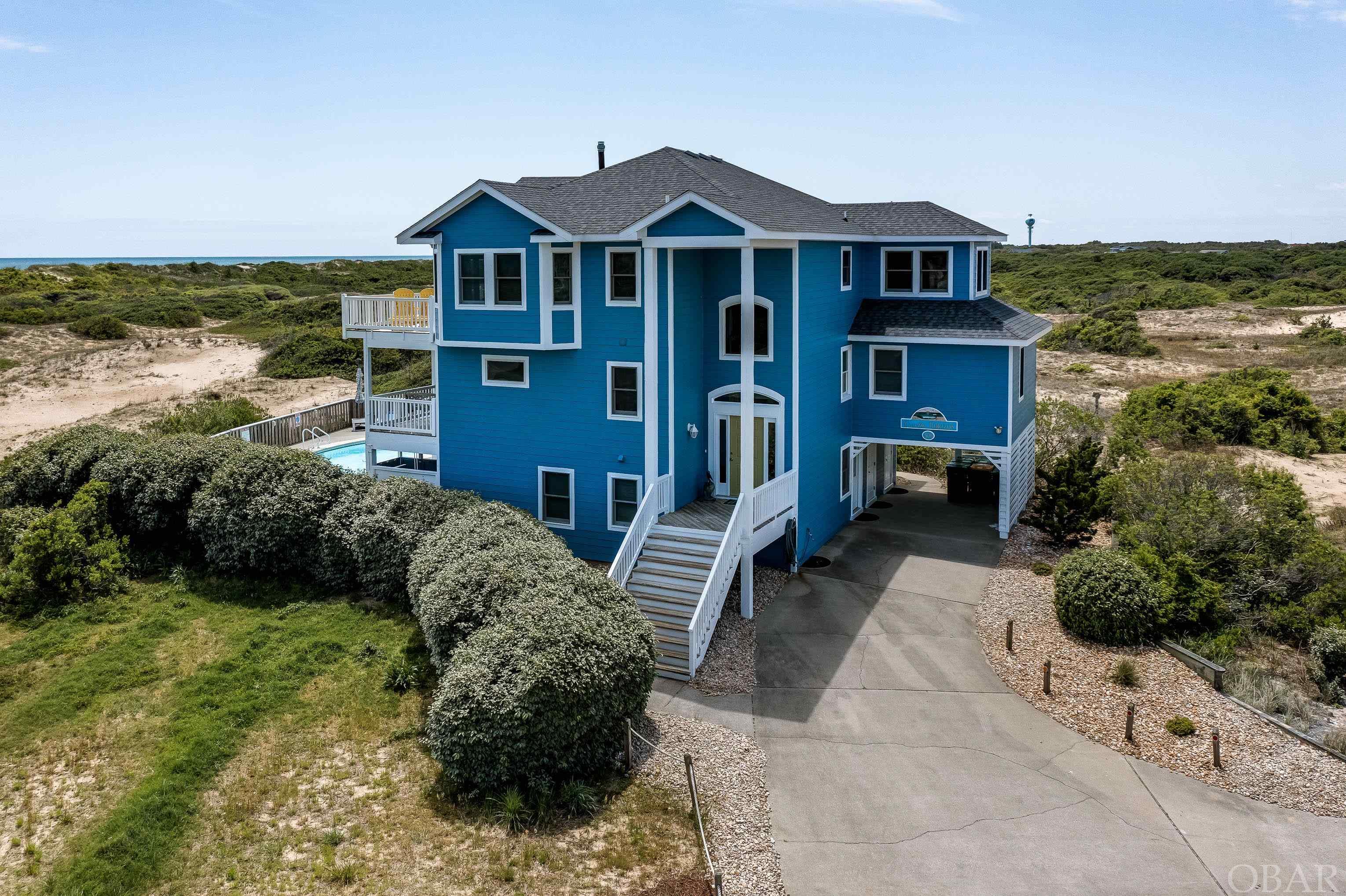 This home has better location, beach access and ocean views than most semi-oceanfront homes!.. Just 150’ to the private beach access! 1/2 acre elevated site in Section A of Ocean Sands South! Incredible, sweeping ocean views to the southeast! " Corolla Horizon " has a fabulous layout, almost 4000 sf heated, 7BR's 5 Full Baths and 2 half baths! Huge game room with small kitchenette, Billiard Table plus sitting area, opens to a large pool w/ lots of room to spread out! All bedrooms are spacious, 3 are master suites and 3 of the 4 other BR's have adjoining baths! Laundry room on mid level! Large great room with a big kitchen, dual dishwashers, huge island bar plus adjoining dining area (could double as home office)... great for card games and also doubles as a sunroom! Great room is adjacent to large open oceanside decks and a southern exposed screened porch! Quality wood accents, gas log fireplace with built-in entertainment center! Whole house charcoal filtration system and a hot water recirculation system.  New exterior paint! Quiet Cul-de- sac location, direct ocean access, 6 owner closets, no through traffic here! Recent Improvements: All new Tv’s in the last year, two new heat pumps (one in 2021 the other in 2022), 25 of the windows were upgraded last year, new concrete coping and tile in the swimming pool 2018, New vinyl railing on decks (2016 & 2019) and Roof replaced 2016.