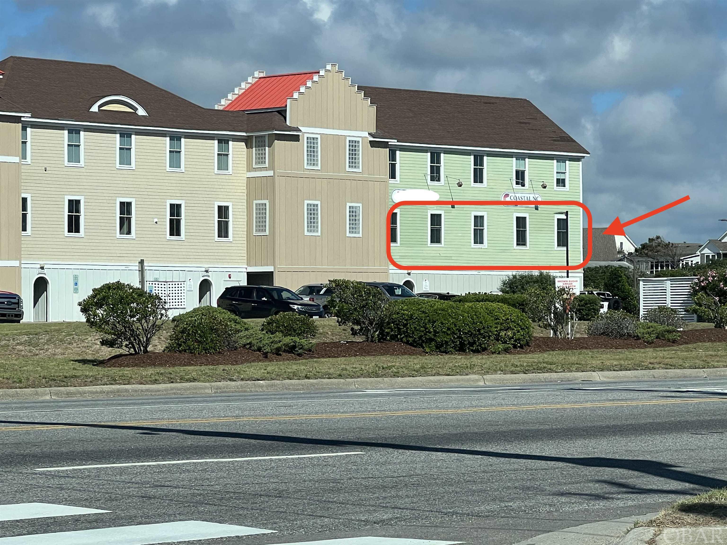 Great opportunity for highly visible commercial condo right in the heart of the OBX. Unit consists of reception area, 4 offices, kitchen, restroom,  and storage area. New LVT flooring and paint within the past 5 years. Elevator access as well as stairs. Highly visible from 158 Bypass. Also included is 1 bay garage on N side of building.