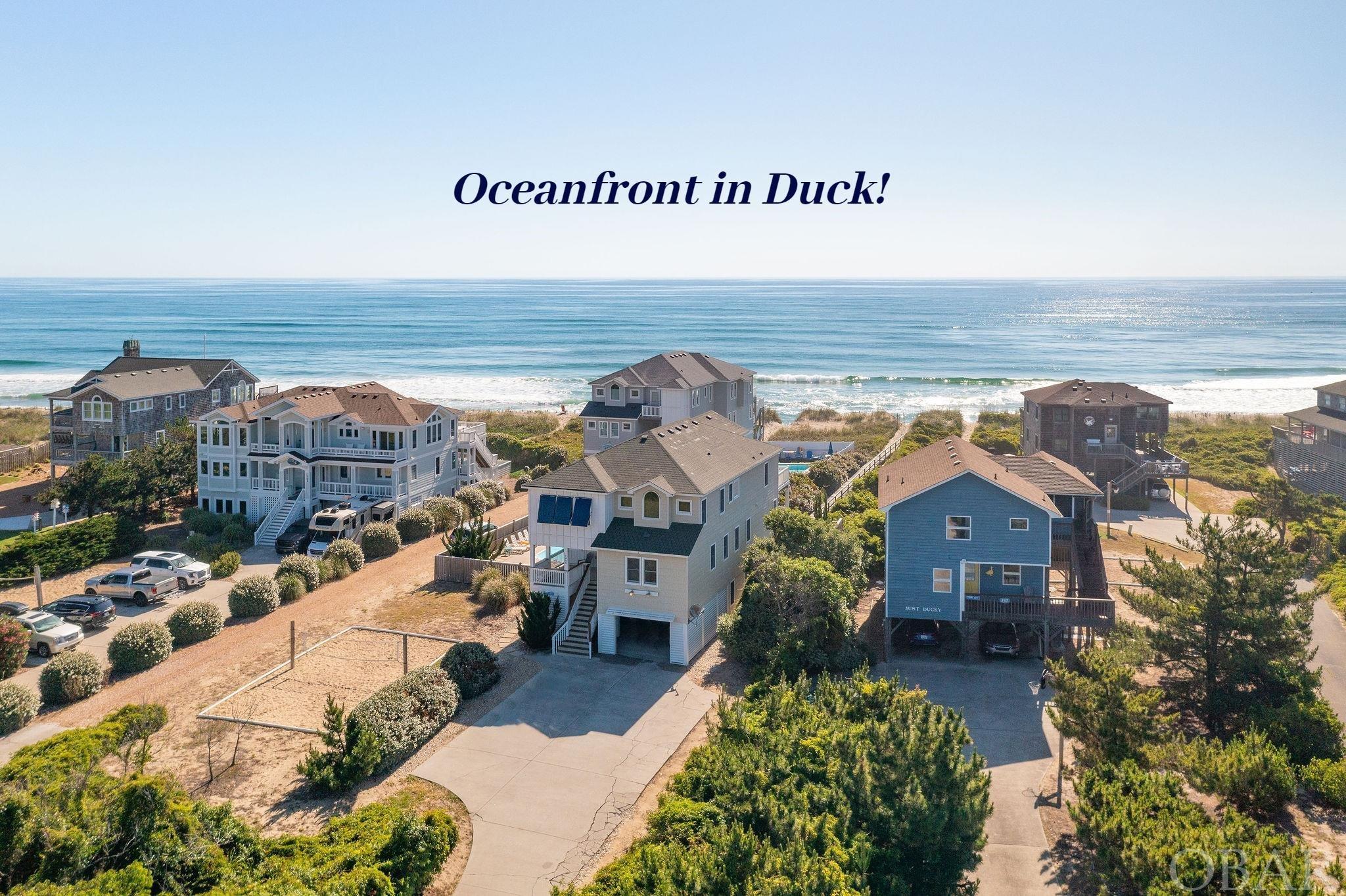 Here is the Duck Oceanfront home you have been WAITING for!  Situated at the end of the street on a cul-de-sac with no thru traffic, this 8 bedroom, 7.5 bath home with 6 Ensuite Bedrooms is THE ONE!  The home has full on OCEAN VIEWS yet set back from the dunes with it's own private walkway, allowing you easy access back and forth to the beach so the property is much more protected than many in the area.  Tired of looking at oceanfront homes with views only from the top level? This home features additional OCEAN VIEWS FROM THE MID LEVEL where two of the ensuite bedrooms are situated with deck access! The upper level floor plan was well though out and is IDEAL with an open concept layout with the living, dining, and kitchen all on the ocean side allowing for a ton of ocean views from the common areas.  There are TWO west facing Ensuite bedrooms on the top level as well as a powder room for guests.  The kitchen is amazing with two refrigerators, two dishwashers, two oven/ranges, huge island bar with plenty of seating and a separate coffee/wine bar area with its own sink and wine cooler! Looking for all the bells and whistles?  Well look no further, as this home features an ELEVATOR, game room with pool table and kitchenette with full size fridge and microwave and bath accessible to pool area, theatre room, and access out to the private pool, hot tub, putting green, and gate to private walkway to the OCEAN.  Make an appointment today to see this home before it's scooped up by a very lucky buyer!  Over 223K in gross rental income booked for 2022 and almost 90K already booked for 2023! More pictures coming soon! Please Google " Beach Music Twiddy Duck" to access the rental site for this home for more details! Attention Investors: If 2023 calendar is opened up from March through the end of the year this home is capable of producing 280K plus in gross rental income!