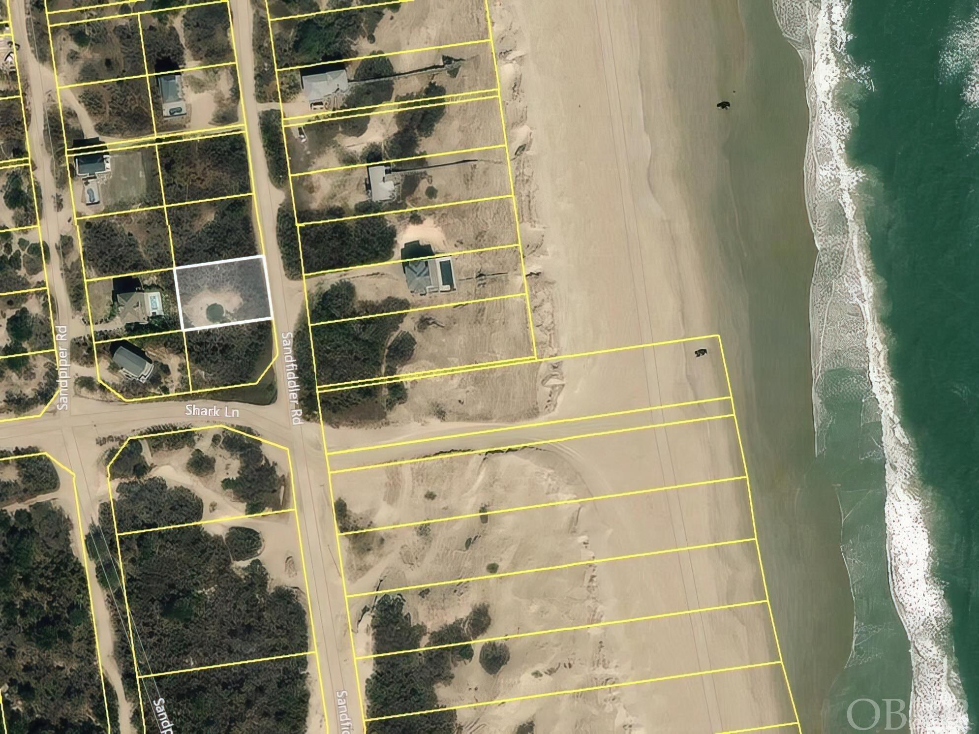 A beautiful Semi-Oceanfront home site in Carova Beach that doesn't have a lot of houses in front of it. Located near the heart of Carova Beach by the fire station with convenient access to the beach, out of the 500-year floodplain, and a GREAT PRICE! Ocean views should be possible from the windows and decks of your future beach house. Walk to the beach, or hop in you ATV and scoot on over to the Carova Beach Park. This lot has a lot of possibilities. Just pick your plans, build your house, and enjoy the views! Between the Dolphins swimming in the ocean, the pelicans gliding through the air, and the Corolla Wild Horses grazing on the Dunes what's not to love.