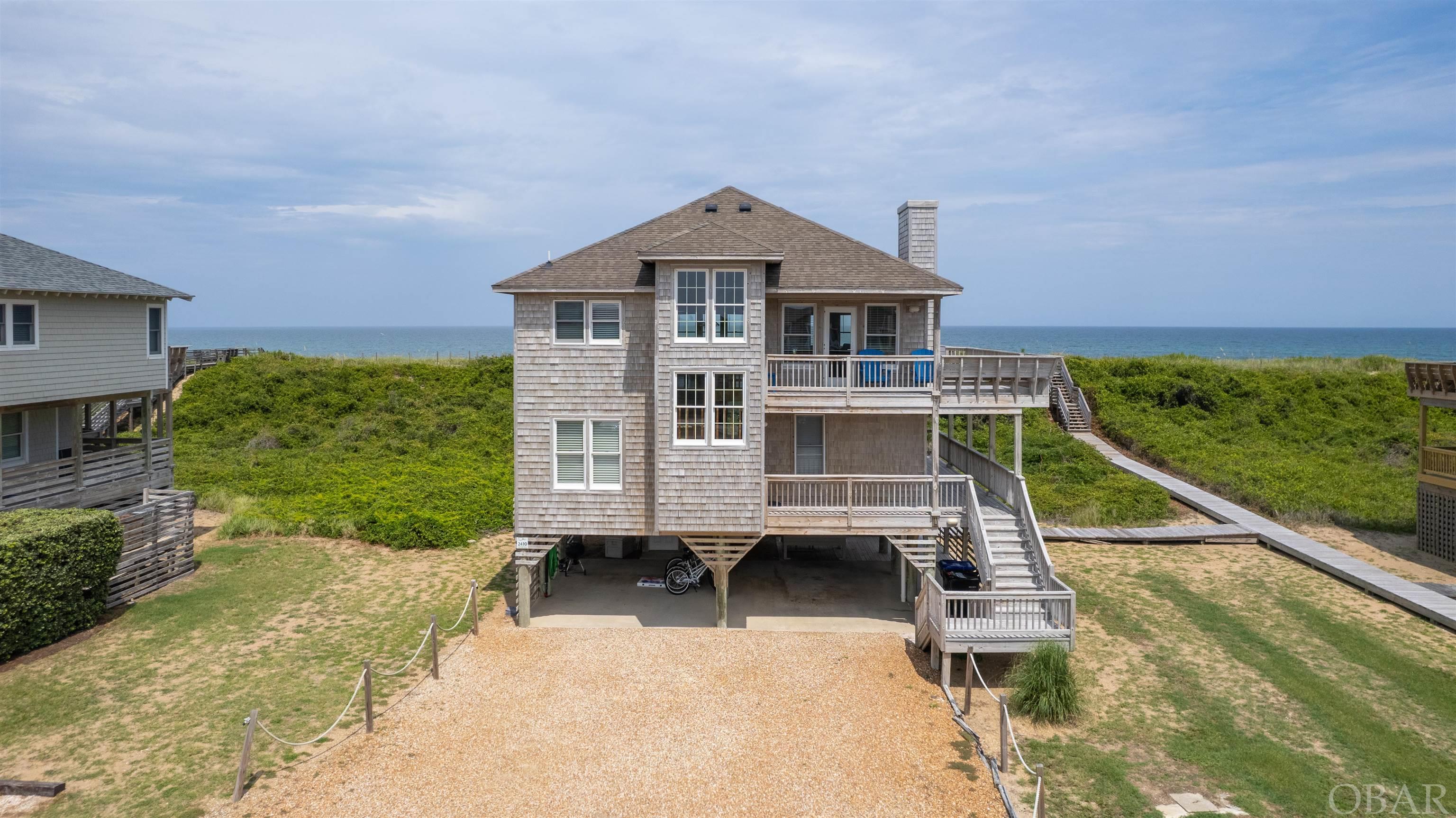 Enjoy Amazing Sunrises & Sunsets from this lovely Oceanfront Sanderling Home! This community is well known for Preserving as much of the Natural Beauty of the Outer Banks as possible. From the moment you turn off of NC12 you will feel like you have entered a Nature Preserve at The Beach.  Your Direct Beach Access and Spectacular Ocean Views complete the picture! Top floor features a Spacious Open Floor Plan with Living Room, Dining Room & Kitchen with Granite Countertops, Custom Glass Backsplash and Soft Close Cabinets and a Half Bath. Juniper Cathedral Ceilings and an Oceanfront Reading/Media Room with a Door for Privacy provide a Great Space to Kick Back & Relax.  Lower level has 4 Bedrooms including the Oceanfront Master Bedroom with access to the Shade Deck.  The ground floor features a Large Outside Shower and separate Foot Shower so you can rinse those "Toes in the Sand".  Amenities include Community Pool, Tennis Courts, Health Club and Sound Access.  Close to all of the Shopping, Restaurants and Entertainment that the Village of Duck has to offer.  New HVAC upstairs 2022, downstairs 2021. If you are looking for a Little Slice of what the beach "Used To Be Like" make "Come Sail Away" your new Port O' Call.  2023 pre bookings in assoc docs.