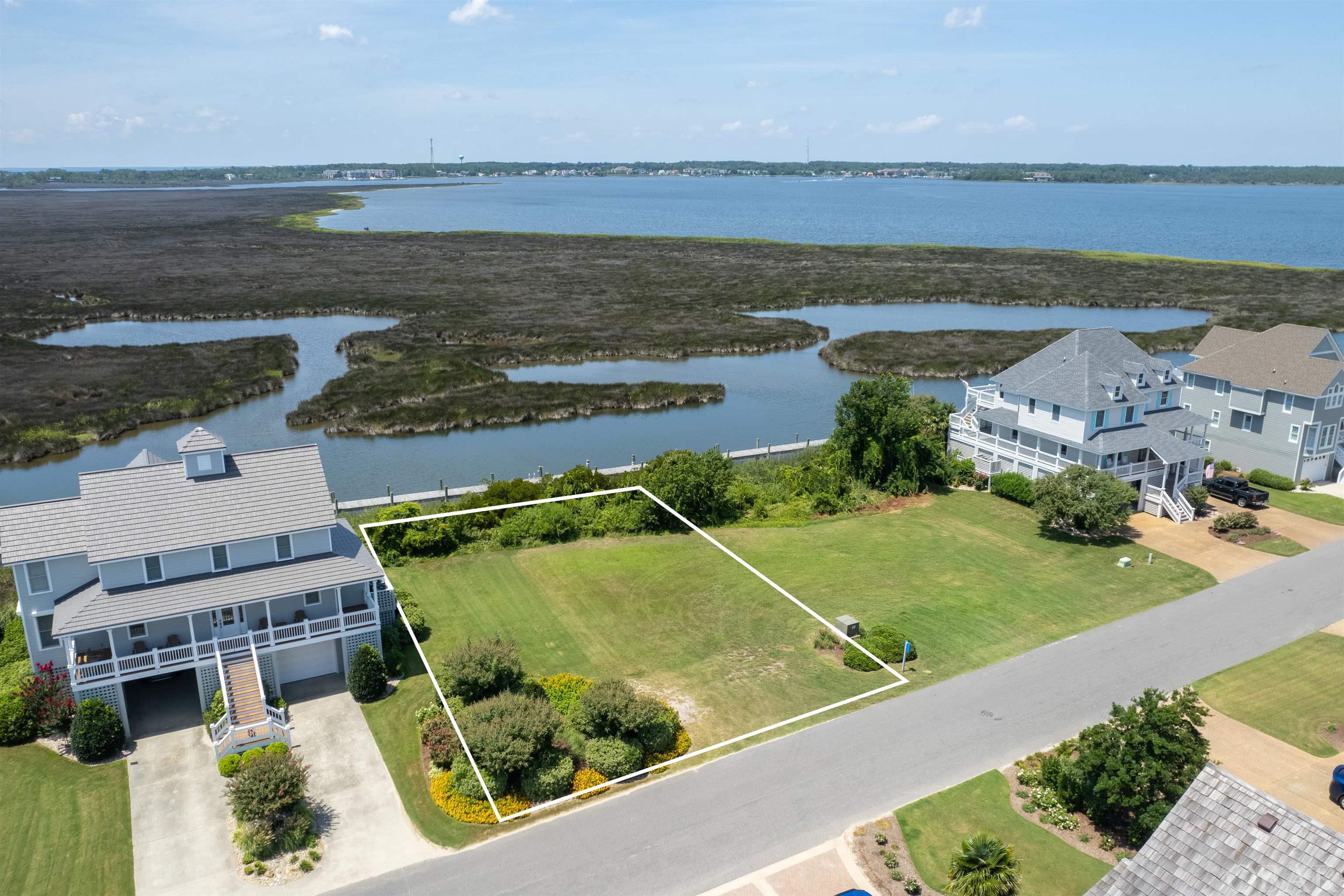 Build your waterfront house on one of the last lots left in Pirate's Cove.  This 11,285 square foot lot showcases beautiful sunsets and is located in the gated community of Pirate's Cove and conveys a 35FT boat dock (slip 43) assigned by the HOA . Community amenities include: the Pirate's Cove Fishing Marina, two swimming pools, clubhouse, tennis courts, fitness center, playground, commons area, on-site restaurant with Tiki Bar and 4 miles of perimeter docking perfect for walking or fishing.  Seller in the associated docs.