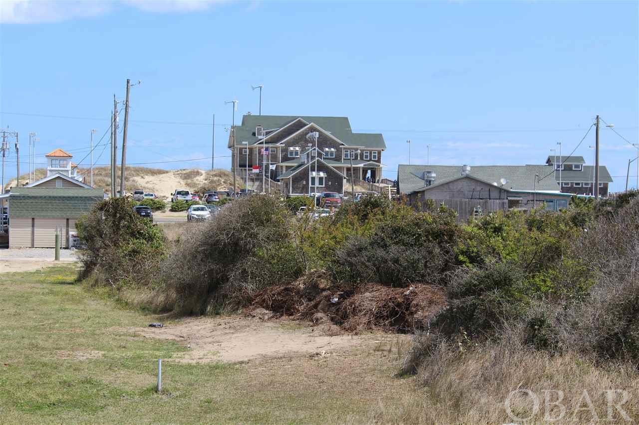 "Jennette's Cottages" Was fully approved in 2018 as a Cottage Court consisting of 6 houses, 24 bedrooms with pool at Whalebone Junction, located directly across the street from Jennette's Pier and directly adjacent to Sam & Omie's Restaurant. This parcel of land extends from the Beach Road to US 158. Great ocean and sound views.  As there have been no significant changes to the Town Code affecting this type of development approval should be a piece of cake.