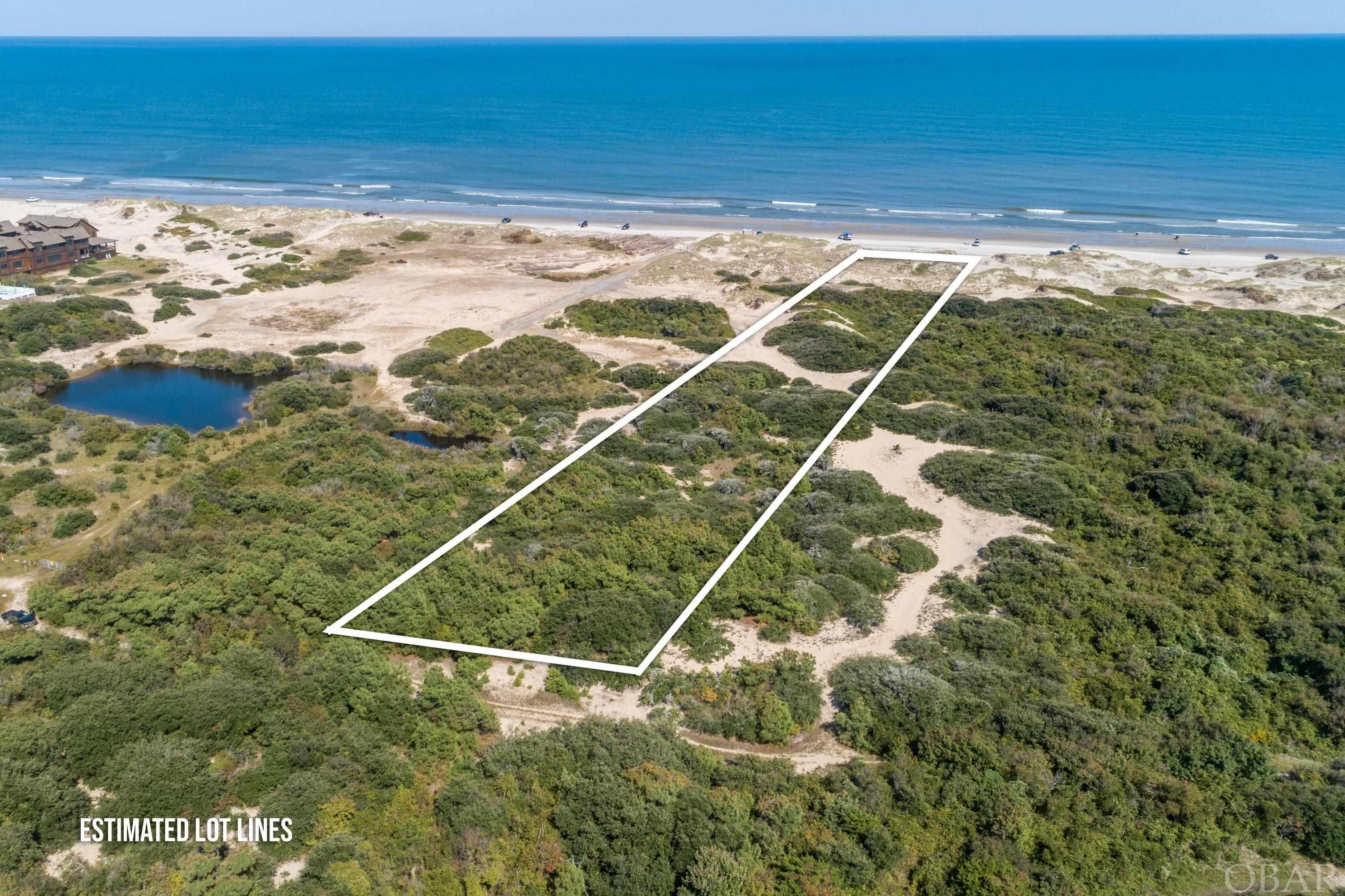 Ocean Front 2.98 Acre Lot with Elevation and Amazing Ocean Views !!   There are only a few Ocean Front lots left in North Swan Beach and this lot is one of the closest lots to the pavement. This beautiful almost 3 acre lot has 125 feet of beach/ocean frontage with it's own beach road access and is located in the 4 Wheel Drive Area of Corolla where the Wild Spanish Mustangs roam.  The perfect place to relax and enjoy the ocean and sound views, feel the ocean breeze and listen to the ocean sounds.   Here is a great opportunity to build your own beach home on an Ocean Front lot that offers a large area to build in the preferred Flood Zone X. Survey from 2020 on file. You can have it all - Beauty, Privacy, Acreage, OceanFront, Views, Flood Zone X and Proximity to the Pavement!  If you are looking for a beautiful large 2.98 acre Ocean Front Lot with Amazing Ocean Views and Sound Views that is located only about 1.7 miles from the pavement in Corolla, then this is the Ocean Front lot for you!