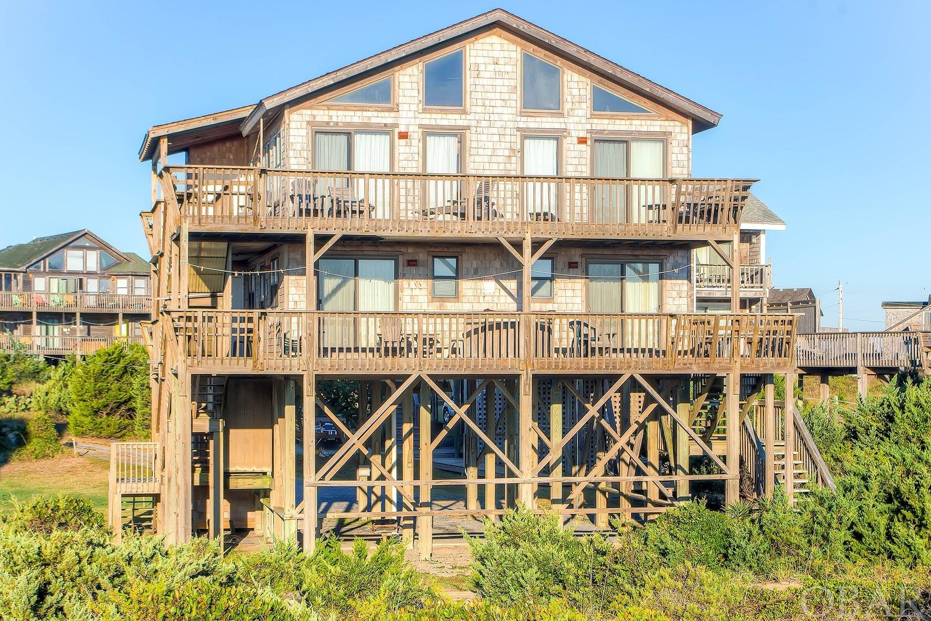 Looking for an unforgettable oceanfront vacation home? Look no further than 39289 N Kinnakeet Drive in Avon, NC!  Back on the market through no fault of the seller.  This stunning 4-bedroom, 3-bathroom home offers BREATHTAKING 180 degree unobstructed views of the Atlantic Ocean.  There is an elevator that opens on each floor for easy and convenient access.  There are ocean views from both of the East facing 2nd level bedrooms as well as the hot tub on the covered 2nd level deck.  Up on the main level, you'll be blown away by the AMAZING ocean views from the wall of windows in the living area.  The great room is spacious and perfect for entertaining guests, with plenty of room for everyone to relax and take in the incredible ocean views.  Step out onto the expansive deck to take in the ocean breeze and enjoy the relaxing sound of crashing waves.  When it's time to head to the beach, you'll be amazed at how wide and clean it is, with substantial dunes offering plenty of protection. It's the perfect spot to spend lazy days lounging in the sun, playing in the waves, or building sandcastles with the kids.  Don't miss your chance to experience true coastal living at its finest.