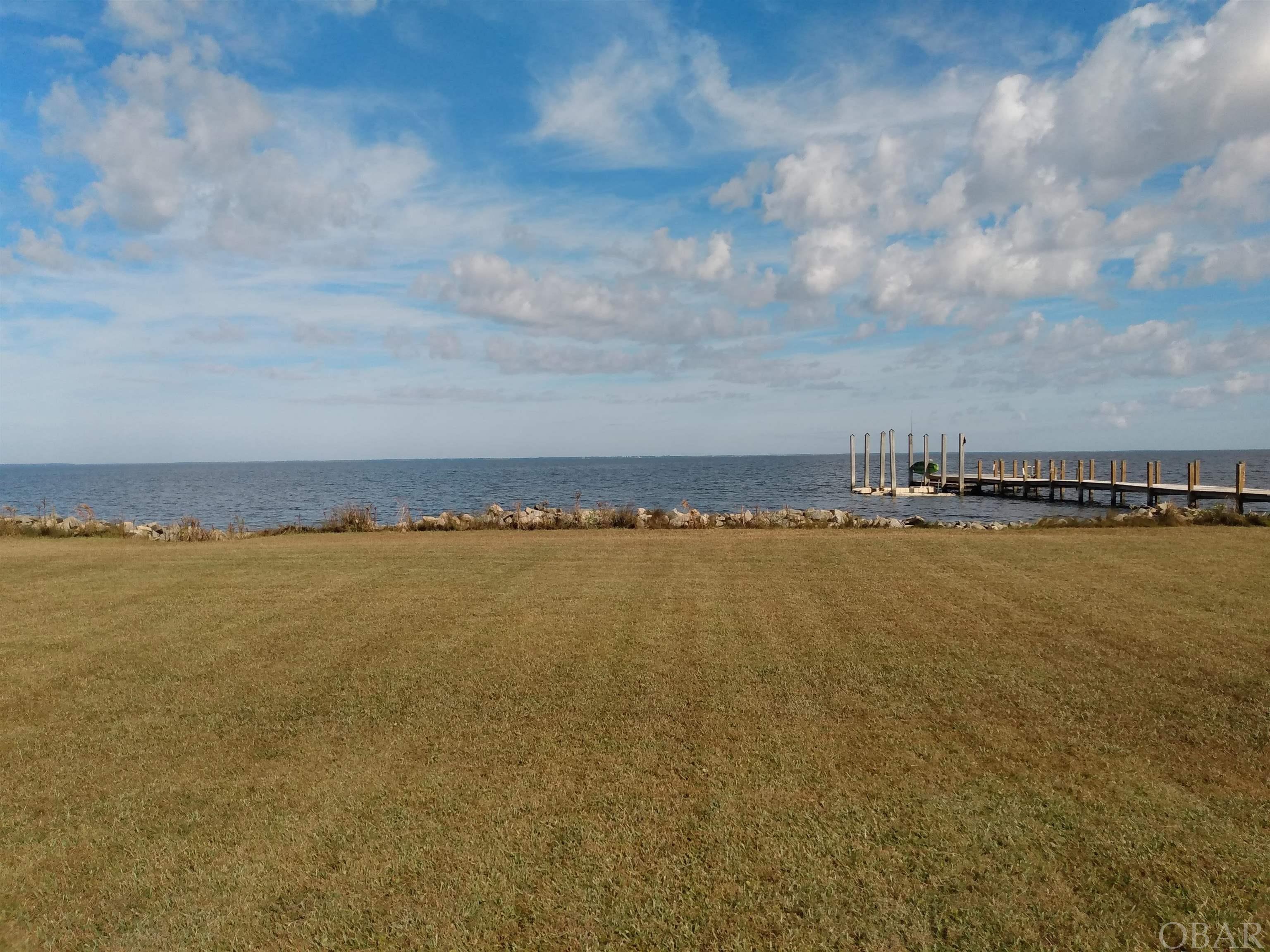 Waterfront Lot #6- Albemarle Sound Estates This well- maintained waterfront lot is priced to sell! Enjoy spectacular water views and gorgeous sunsets of the Albemarle Sound from this property! it has the rip- rap shoreline stabilization structure and underground utilities. Perk Approved! Ready to build your waterfront home on! Nice neighborhood! There is a water access commons area and a small boat ramp which leads into the Sound. To enhance your access to the water you could possibly build a pier, dock and boat lift in the water. This property has the potential to meet all of your enjoyment and watersports needs! Just 5 miles north of Columbia, NC and within an hour to the NC Outer Banks! Offered at $75,500.