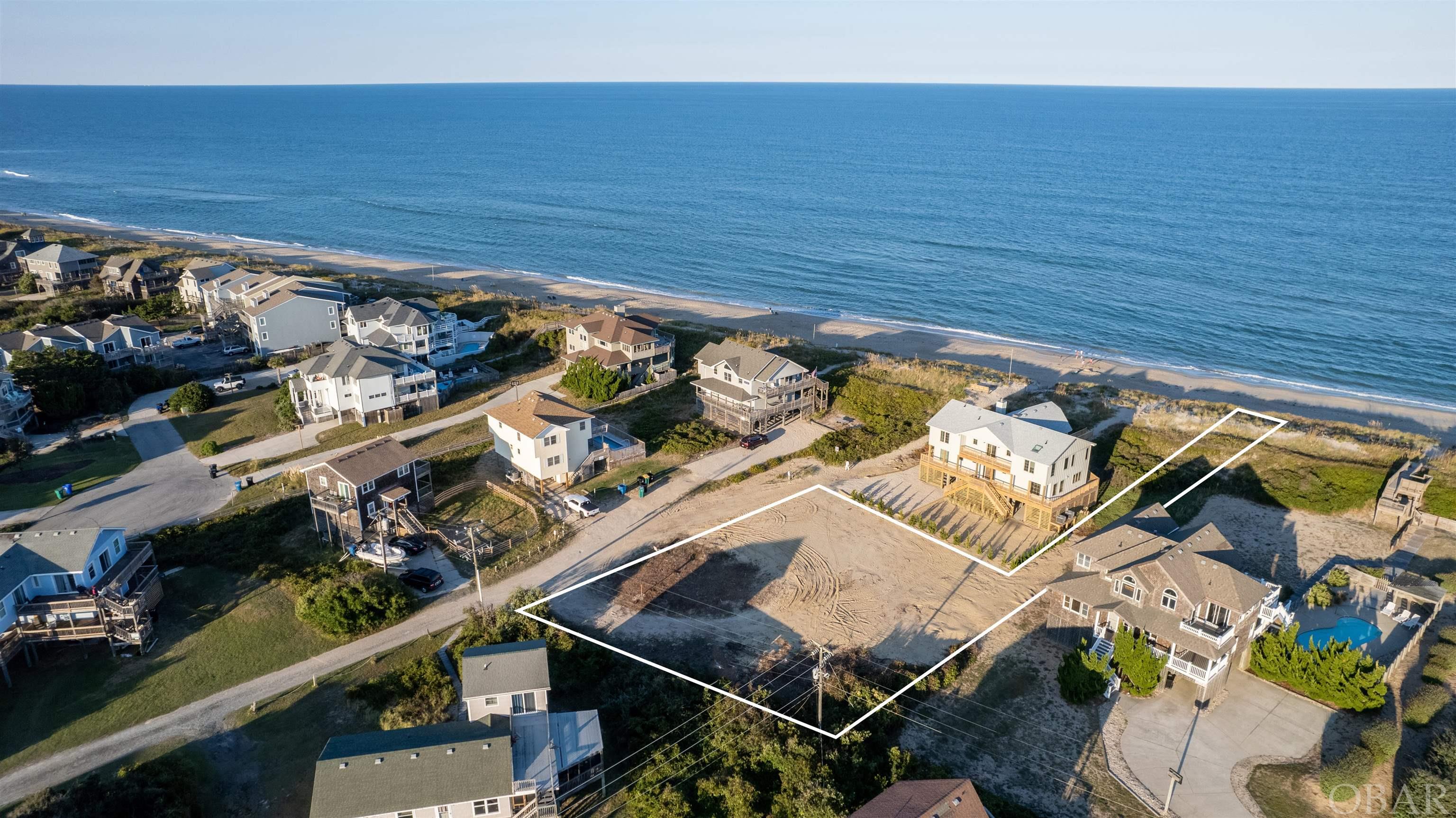 Amazing home site! This is a flag lot with 24' of deeded ocean frontage!  No roads to cross and breathtaking ocean views! Located in the quiet community of Sound Sea Village, where you will enjoy a laid back beach vibe and uncrowded beaches... the perfect spot to build your dream OBX beach home.
