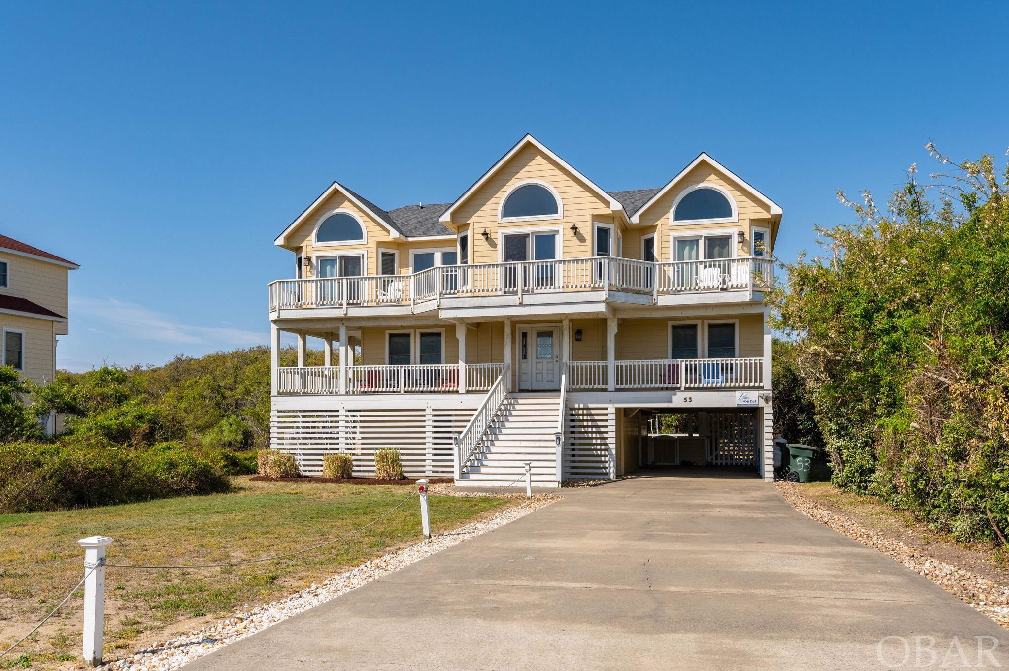 $125,491 in advertised rents in 2022 for this beautiful, quality built, 6 bedroom, 5 full bath & 2 half bath home that offers the opportunity to enjoy the uncrowded beaches of Southern Shores (access right across the street) and easy drive to Outer Banks attractions both north and south.  Enjoy the sunrises from the large east deck(replaced in 2020) and the pool, volleyball court and nature area from the back deck(replaced in 2020). Stunning ocean views are yours from all of the great room windows, the two master suites, and the ocean side deck! This awesome home offers the popular reverse floorplan design, with a huge living/family room area with hardwood floors, gas fireplace, elevated dining area with seating for all, and thoughtful open kitchen area. The fully equipped kitchen has lots of room for the family gatherings as well as multi use seating at the breakfast counter. There is a half bath on the top floor as well as two large “en suite” bedrooms, each with beautiful ocean views and large tiled bathroom areas. Moving to the middle floor, you are welcomed by a large second living area finished with hardwood flooring and ceramic tile.  This level also contains 3 nicely proportioned bedrooms, two of which share a full bath. The en suite bedroom is very large supporting a king bed and a lovely tiled bath with shower and separate tub. This unique bath also has an additional lockable doorway, through which is another commode and shower. This “secret” half bath door opens up next to the hot tub located on the middle west facing deck, a very convenient feature!  Down to the ground level, this family friendly house is ready for fun and entertainment offering a full game room with pool table, television,custom table and chairs, recessed lighting, and the all essential wet bar with second refrigerator. The downstairs bedroom sleeps 4 easily with a 3-person bunk bed and separate single bed with adjoining bathroom. There is a large (6’ x 5’) laundry area housing the washer and dryer. It’s all about outdoor life in the OBX and this house has it all. Enjoy the large aquatic area featuring 11 x 28 in-ground pool surrounded by concrete sun-decking and privacy fence. In addition, there are two outside showers and a volleyball area. One of the special features of this property is that it backs up to the Chicahauk common area full of trees so you won’t have a neighbor peering into your back yard. Bryant HVAC units power the 3-zoned heating and cooling system for efficient energy consumption. There are numerous other features,, but you’ll need to see them to appreciate. Beach access is just across the street!  Great location, on the southern end of Ocean Boulevard, reduces time in traffic on check-in day and it provides easy access to attractions north and south.  Don't miss out, schedule your showing today! Seller has a transferrable home warranty through Home Warranty Inc. Home Protection Plan.   2023 Calender already $92,317 in owner rent. Based on 2022 reservations and 2023 rates $126,000+ is estimated owner gross for '23, by owner.