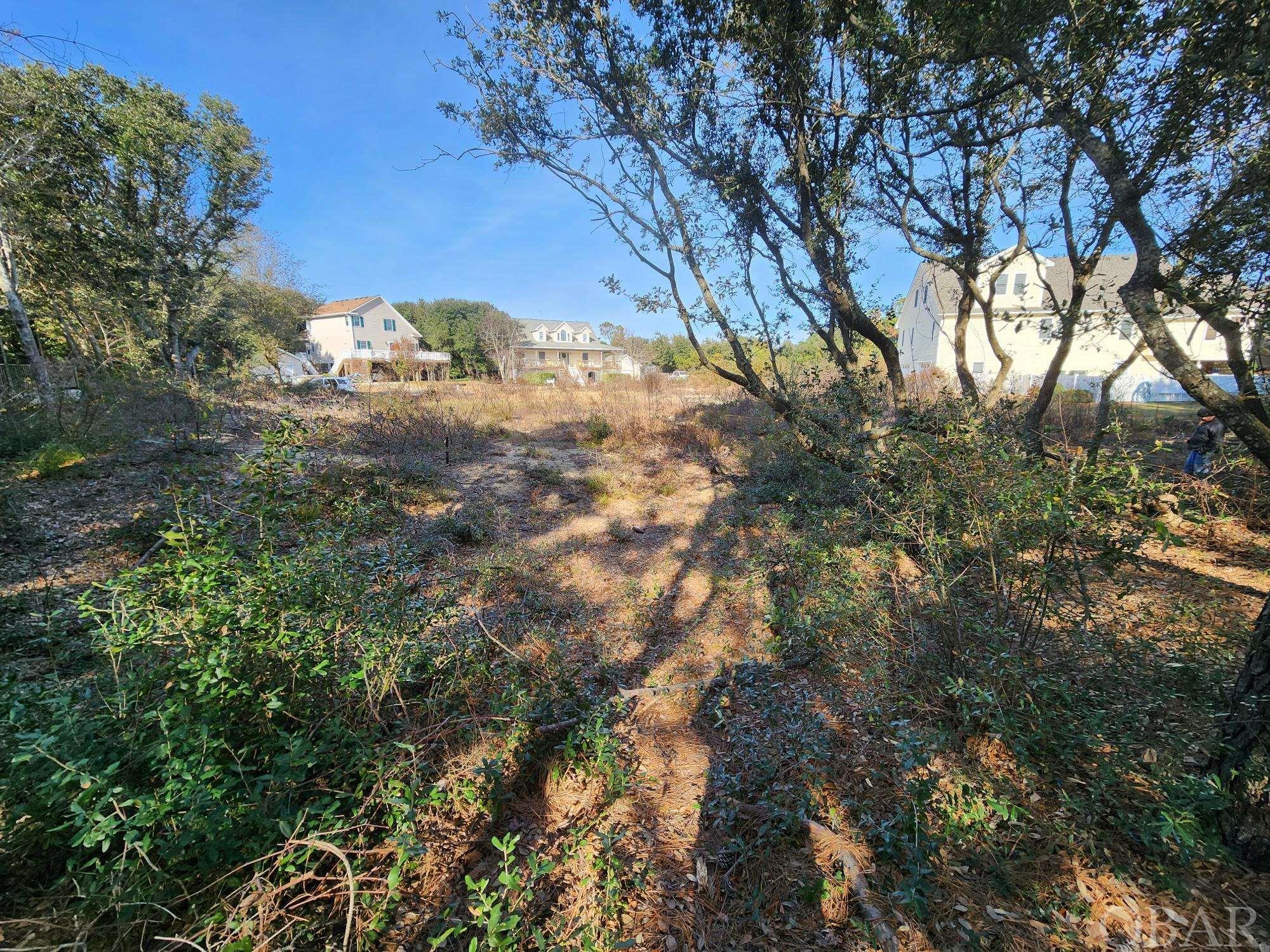 Beautiful Lot in great location!  Not a through street - very little traffic.  Close to many restaurants, attractions and the beach!  The lot has already been cleared and fill brought in.  Custom house plans on file for a spectacular, classic, Nags Head style 3200 Sq. foot house.  Plans included with accepted offer.  Over 100' wide, allows for a great ranch design to be built.  X flood zone = few stairs!  Listing Agent is owner and licensed NC Realtor #225380