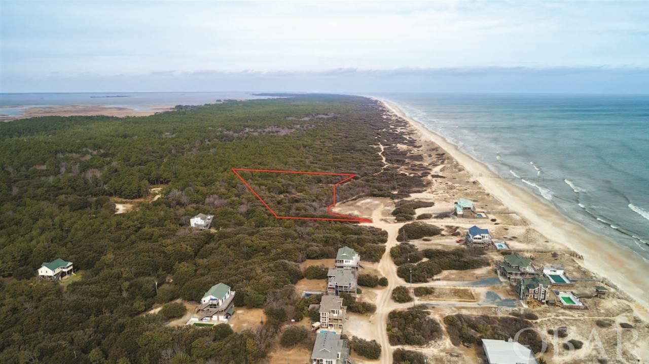 1.74 ACRES!!  This pristine lot is located in the Estates at Carova Beach just one lot south of the NC/VA state line on the remote Northern end of Carova Beach. The oversized semi-oceanfront lot features fabulous views, seclusion, roaming wild horses, a high protective dune line, and is just steps to beach & the protected Virginia False Cape State Park Refuge where you can walk the beach for miles with nobody around. Enjoy stunning ocean view vistas from your future home on this site as well as the elbow room so hard to find on the Outer Banks.