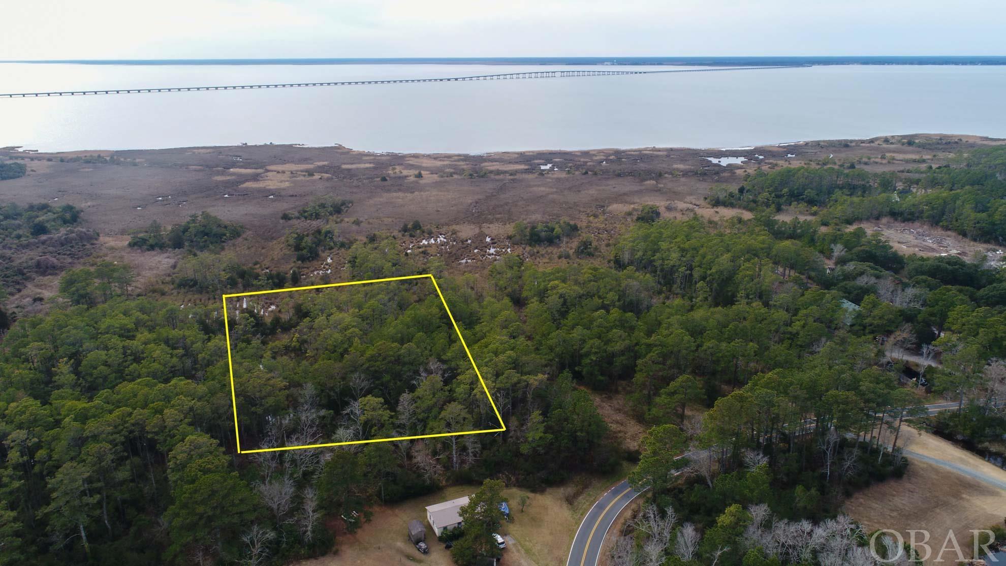 30,000 sqft lot on west side of Roanoke Island.  This semi Soundfront lot could provide water views with proper house design.  The adjoining Soundfront parcel is also available. The three parcels to the are also For Sale