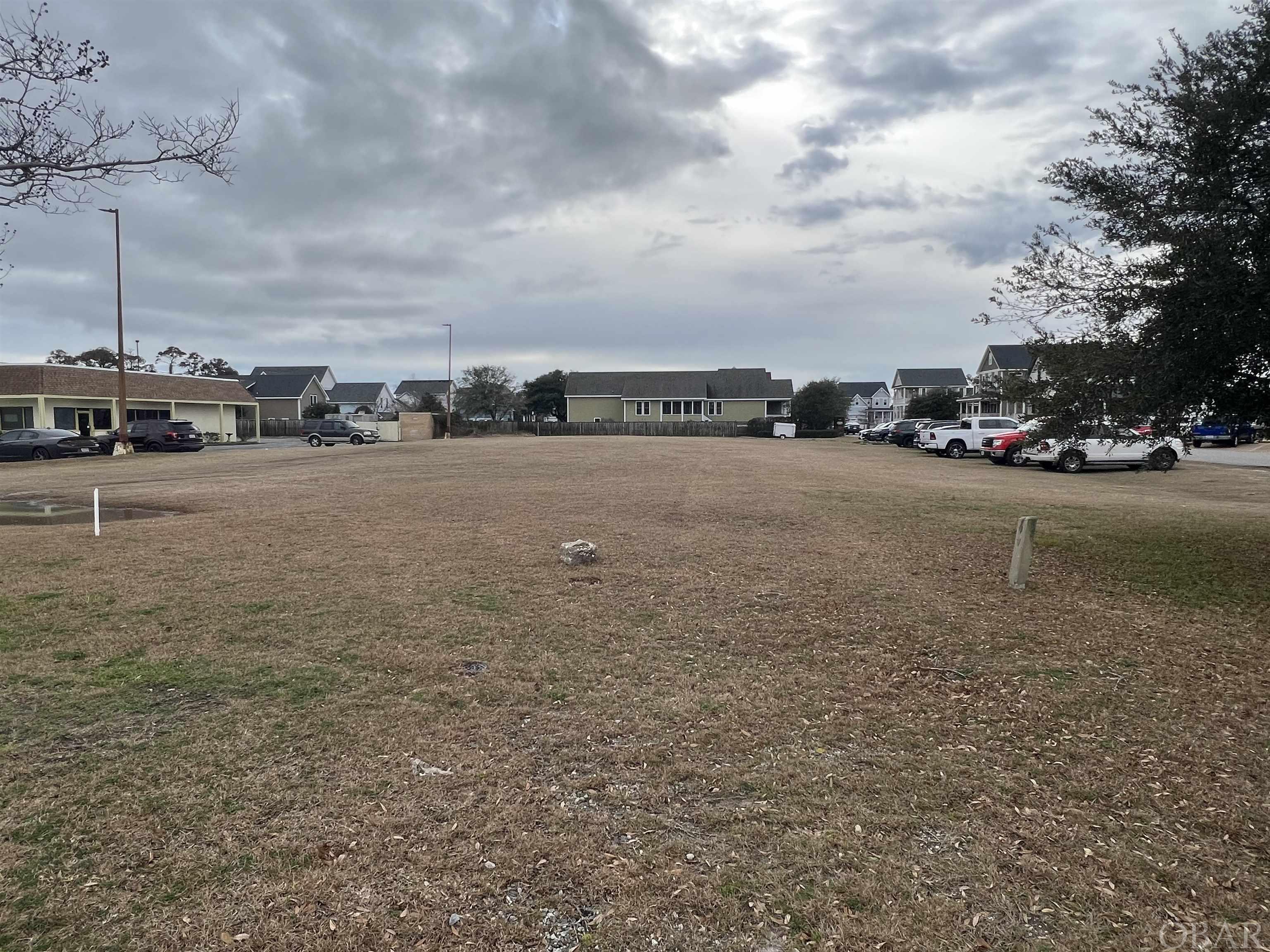 This commercial lot is cleared and ready for your commercial adventure. Almost 3/4 of an acre with a prime location with B-3 zoning allows for many uses for this lot. Municipal water and sewer is available for this property and it is a short drive to Downtown Manteo and the Beach.