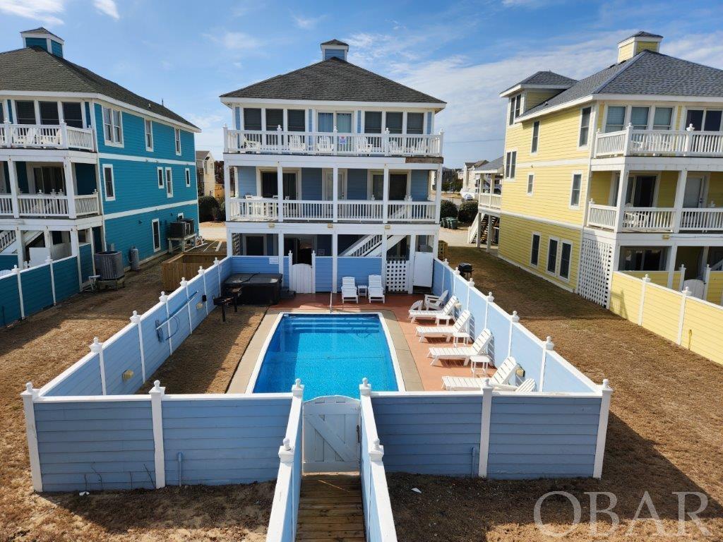 "PRETTY MAMA" OCEANFRONT W/ FABULOUS OCEAN VIEWS! *** ELEVATOR & HEATED POOL ... and HUGE GAME ROOM W/ MINI KITCHEN! *** EXCELLENT RENTAL INVESTMENT INCOME PRODUCER ... 2023 ... 41 WEEKS BOOKED w/ Rents of $236,803 ... a 9.6% (RIGHT ON CUSP OF 10% RETURN!) ... CURRENT RENTAL AGENCY BEACH REALTY PROJECTING 2024 RENTS AT $257,994! *** HOME IS IN AN EXCELLENT RENTAL PROGRAM WITH BEACH REALTY! *** ELEVATOR TO ALL 3 LEVELS * PRETTY MAMA IS AN 8 Bedroom Oceanfront in the Heart of Nags Head w/ Nice Heated Pool, Deep Lot w/ High Protective Dune System *** Original Tax Plat shows Land Dimensions: 50 feet by 418 feet *** Located Approx. Milepost 10 on the Beach Road *** Big Driveway for plenty of Guest and Family Parking *** MULTIPLE En Suite Master BR's w/ Full Baths (See Broker Notes for rental description and website link for this home) * Primary Powder Room just off the Great Room for guests *** Starting on the Top Level 3 - You will love the Large Open Great Room w/ Custom Interior Finishes and Furnishings * Cozy Kitchen w Double Refrigerators * High Ceilings, Gas Fireplace w/ Built in Entertainment Center * Primary Oceanfront En suite bedroom with Ocean Views! * Also, Fabulous Ocean Views from Sun Deck off Great Room - great space to Entertain or to just enjoy the nearly 180-degree Ocean Views, the smell of the salt in the air & the gentle waves releasing on the Beach! *** Level 2 Features Multiple En suite Bedrooms w Full Baths (One Bedroom features a large ACCESSIBLE BATHROOM for those with disabilities) & Oceanside Deck the width of the home - with access from the bedrooms * Main Front Entry Foyer & Front Covered porch mid-level between Levels 1 and 3 *** Level 1 Features a Huge Open Great Room with tile floor, Kitchenette, Pool Table, Sliders out to POOL & Hot Tub & Walkway to Beach! *** 2nd Bedroom on Ground Level off Game Room features door to rear Pool Deck area for easy access to bathroom *** Home Rents w Pets - there is a dedicated pet area (new in 2022) on the South side of the Pool *** You will want to head out past the pool gate to the Dune - Check out the Dune Top Platform Sun Deck - what a great place to take in the beach & the View ... or sit out on a starry night - the Constellations & The Milky Way will WOW you as will the SUNRISES OVER THE OCEAN ... also a great place to have your morning Coffee! *** Close to all kinds of shopping, restaurants, and Family Fun ... miniature Golf, go karts, Wright Brothers Monument, Jockey's Ridge, Pirates Cove & Oregon Inlet Fishing Centers, Downtown Manteo & so much more! *** PRETTY MAMA is offered fully furnished (with listed exclusions) *** NEW IN 2022: Interior Touch-Up Painting, New Ceiling Fans, Various New Decor, including leather sofa, new lamps, new area rugs, New King Bed Mattresses and Bedspreads, New Full-Size Refrigerator, New PVC Tables, New Park Grills, New Dog Run, New Pool Liner, New Rec Room TV Added, New Dune Deck Flooring and some new Walkway step treads *** New in 2023: Microwave, refinish dining room flooring, tables and chairs, Elevator upgraded to meet Weston's Law, replaced faucets and shower heads in bathrooms *** See Rental Company Beach Realty K1226 Pretty Mama Photos & Description at rental Website Link: https://www.beachrealtync.com/outer-banks-rentals/pretty-mama  *** 2022 Owner Rents totaled approximately $215,779 ... First 5 weeks were VRBO Rented Weeks, Remainder of 2022 rented weeks through Beach Realty *** Beach Realty YTD 2023 ... 41 WEEKS BOOKED w/ Rents of $236,803 ... a 9.6% (CUSP OF 10% RETURN!) *** 2024 YTD Rents Booked as of 2-12-24: $160,001 ... NOTE: BEACH REALTY PROJECTING 2024 RENTS WILL BE $257,994! *** Hit the Ground Running!!! ... "Pretty Mama is in the ideal location for visiting the OBX to the north or south and close to the best places to eat. It had all the amenities we needed i.e. elevator, pool, oceanfront and pet friendly. Everyone from Beach Realty were friendly." *** You will Love this Oceanfront Home ... Come see!