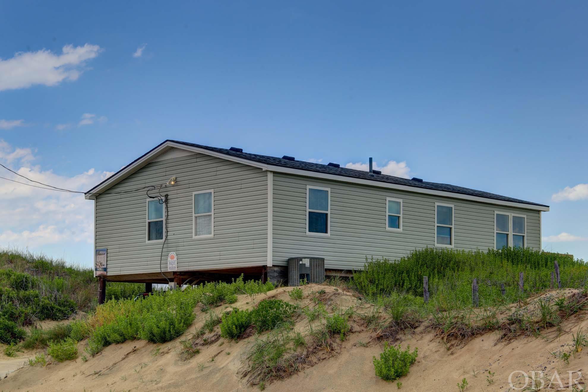 **Beautiful Kill Devil Hills Oceanfront** High ROI ** Low Expenses** New Decking **$78,200 for 2021 GRI** Roof 2019***  If you are in the market for strictly an investment property, this home has a great ROI with low expenses (equalling a great NET Income/Bottom line). This home has the potential to have bookings throughout the year and produce even higher numbers with a open calendar (and less owner weeks reserved).  If you are searching for the rare Kill Devil Hills Oceanfront to enjoy with your family, this home will delight. Talk about dining with a view; this home enjoys tons of natural light and simply spectacular views that are unforgettable.   Simple yet Spacious, this home is a must see. The Coastal Chic decor has guests coming back year after year for another week full of memories. With four (4) bedrooms, this home feels cozy yet has plenty of room to spread out. The two ocean facing sliders, the main attraction is always on full display to enjoy. No matter the season, the new decks provide the perfect place to relax with cocktails or coffee or enjoying the freshest bounty from the sea!  This is a rare find on the beach! This gem is a "must see."