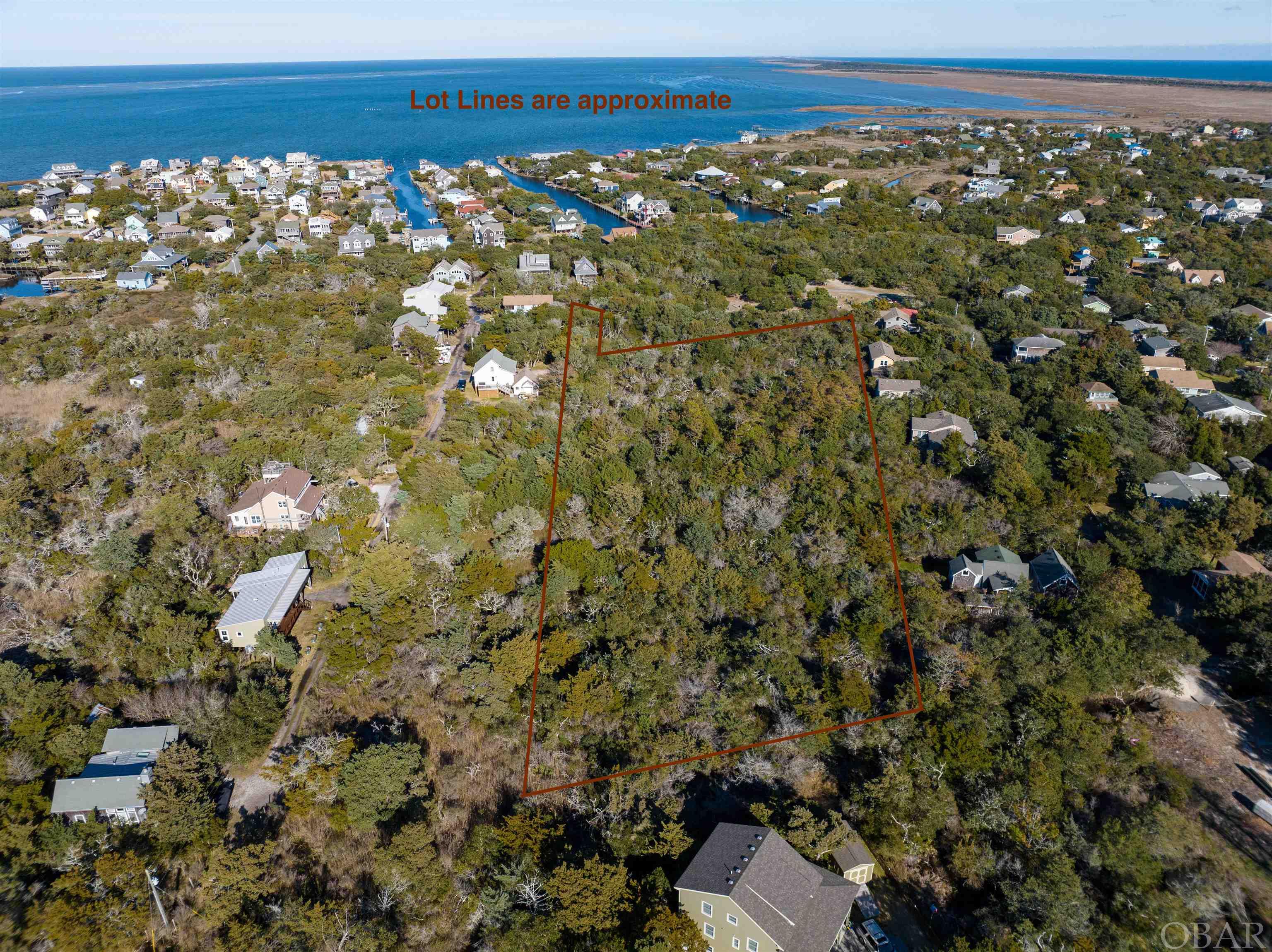 2.5 acres, 21 lots on Ocracoke! Enjoy the privacy and seclusion of this beautiful, wooded land while you build your dream home(s) in the heart of Sunset Village. Property has a mix of natural uplands and wetlands. There is approval for two 4 bedroom peat septic systems on lots 55 and 56, permits on file. Access is via a public deeded right of way, "3rd Avenue,"  which is currently unbuilt. Elevation maps in supporting documents.