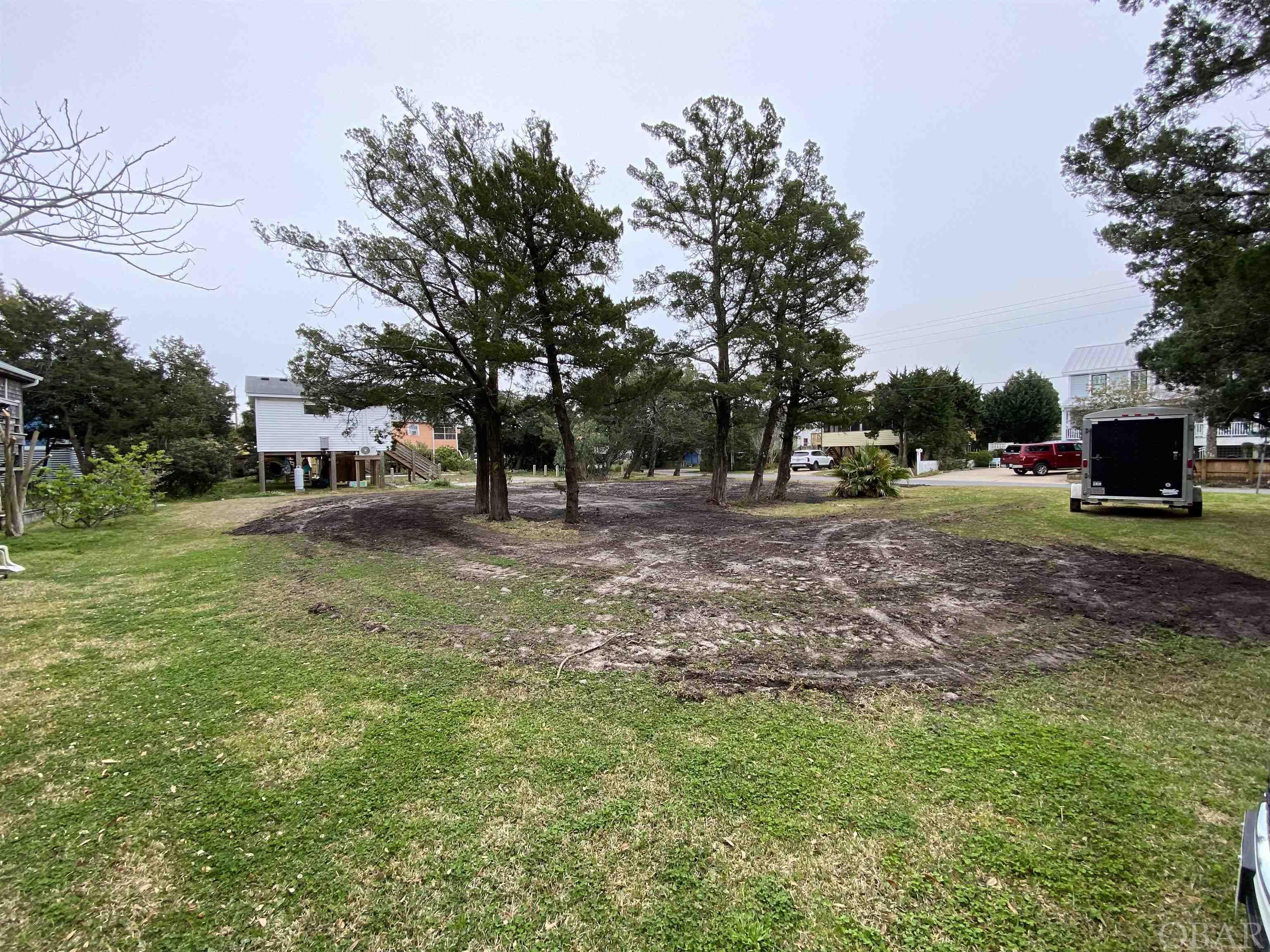 This corner lot is perfectly located in a residential setting a stones throw from coffee shop, restaurants and local shops.  The lot formerly housed a duplex and consequently conveys with 2 water meters and a 4 bedroom septic permit.