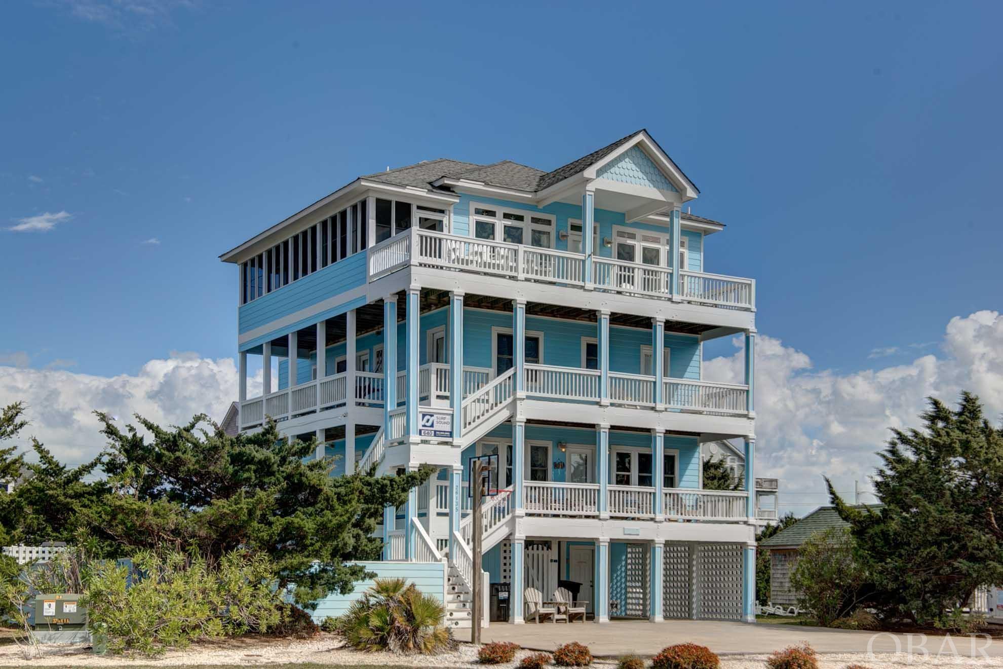 Your search for the home-that-has-it-all is complete!  "Frolic Inn" is the ultimate vacation/investment home sporting a beautiful & delightful beach decor - and comes "equipped" with gorgeous sound and marsh views, sunsets, and stunning dark sky views. Frolic Inn's upper level offers a grand Pamlico Sound vista; comfortable and tasteful furnishings; a lovely cook's kitchen with two dishwashers and two stoves; dining for fourteen; a huge sun deck; a nicely furnished screened porch; and elevator access to each floor and the ground level.  The master on this level has deck/screened porch access and compartmented bath and vanity areas. Welcoming, "themed" bedrooms on the next levels add to the total beach experience; each is cheerfully painted and decorated with its own coastal motif and each offers shaded outside/deck access with sloped ramp access from each bedroom.  Outside on the ground level, you can take your pick from the large private pool; children's pool & sandbox; screened Tiki bar (cable-tv-ready) with hot tub and built-in picnic area; volleyball; horseshoes; basketball; and two ample storage areas for guest items. Unique, first-rate items abound: trex decking/landings; swiveling door curtain rods; 2x6 framing; 3 course rebar construction in elevator shaft; Adura tile and planking; built-in hair dryers in each bath; media room extra sound insulation; generator hookup; and even a cost saving solar-powered hot water heater (and extra new electric standby water heater). The owners have continued a high-quality standard for their home with numerous recent improvements: NEW FORTIFIED ROOF just completed; new range; new dishwashers; top floor HVAC; pool pump & heater; new living area sofa, loveseat, and swivel chairs; new dining room chairs; washer/dryer(s) replaced in 21 and 22; exterior paint; new hot tub motor; new pool table; new hammock; new extra hot water heater; and much more.   Neighborhood amenities include the WOW community boat ramp/dock and boardwalk AND beach access thru reciprocal agreement with oceanside Hatteras Colony s/d. Nearby attractions are the TriVillage walk/bike path; local shopping and dining; NPS Salvo day use area; and 4WD beach access at the south end of the village. Come see all this lovely home and great location have to offer!