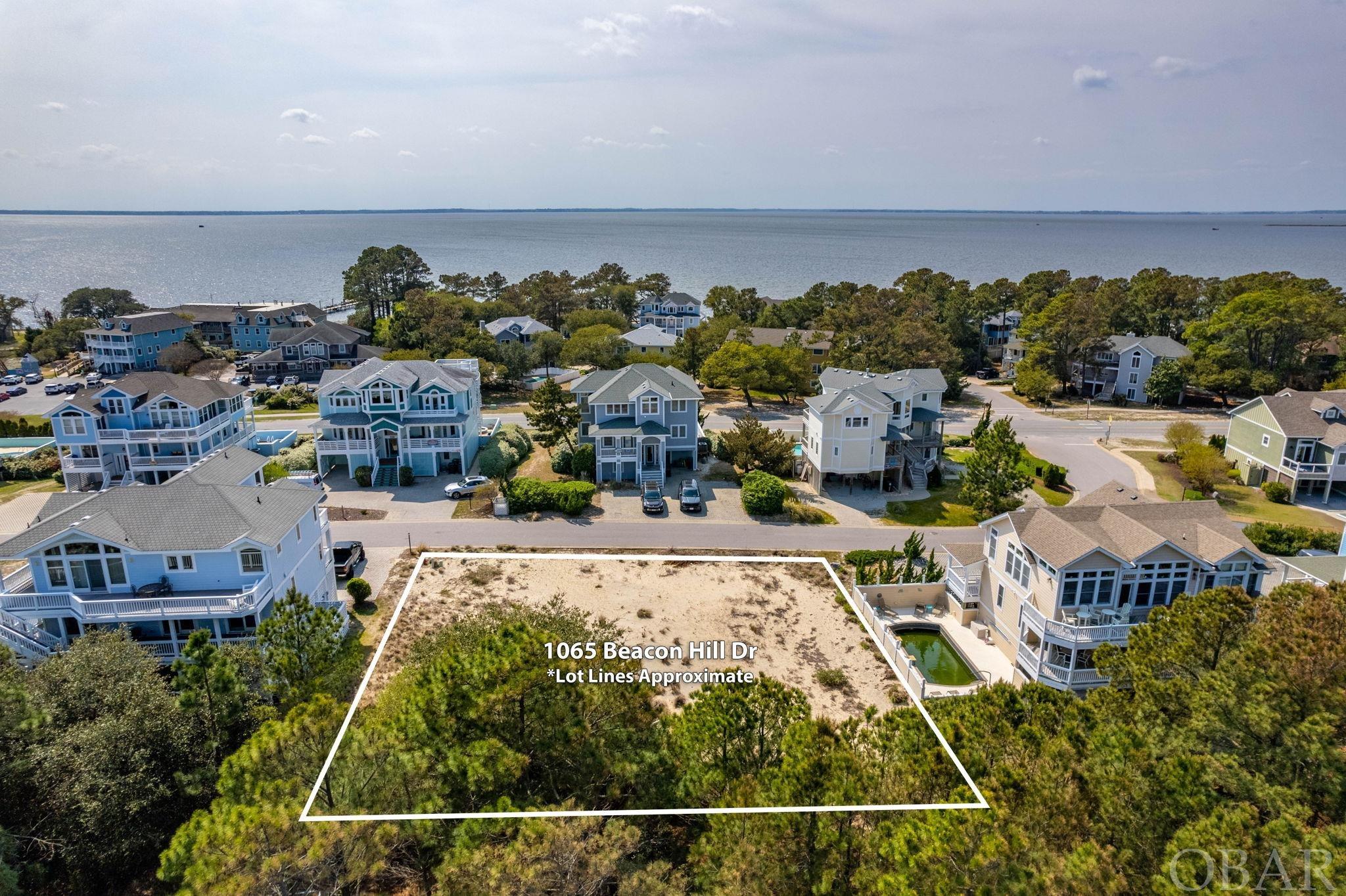 Fantastic, elevated building site available in the renowned community of Corolla Light Resort.  Ocean and sound views possible from the top level of your custom built home.  Located on an X flood zone lot, this desirable high and dry site includes all the Corolla Light Resort amenities discerning owners and vacationers appreciate.  With amenities from ocean to sound, homeowners and their guests have access to the Oceanfront Complex with beach access and oceanfront grill, Sports Center with indoor pools, tennis courts and workout classes, Sound side pools, piers, and trails, as well as pickleball and tennis courts, bike paths, and seasonal trolley service to name just a few.  (See Assoc Docs for full list of amenities.)  Build a custom home for primary use or as a rental investment complete with the ability to enjoy all the activities that make Corolla Light a premier family friendly destination.  Why settle for a home that only meets some of your expectations?  Build your own dream home just the way you want it!  (See CL CCRs in Assoc Docs for building guidelines.)  This property is conveniently located near the boutique shopping, restaurants and attractions of the northern beaches including the Currituck Lighthouse, Whalehead Club, and the famous Corolla wild horses in the 4-wheel drive area.