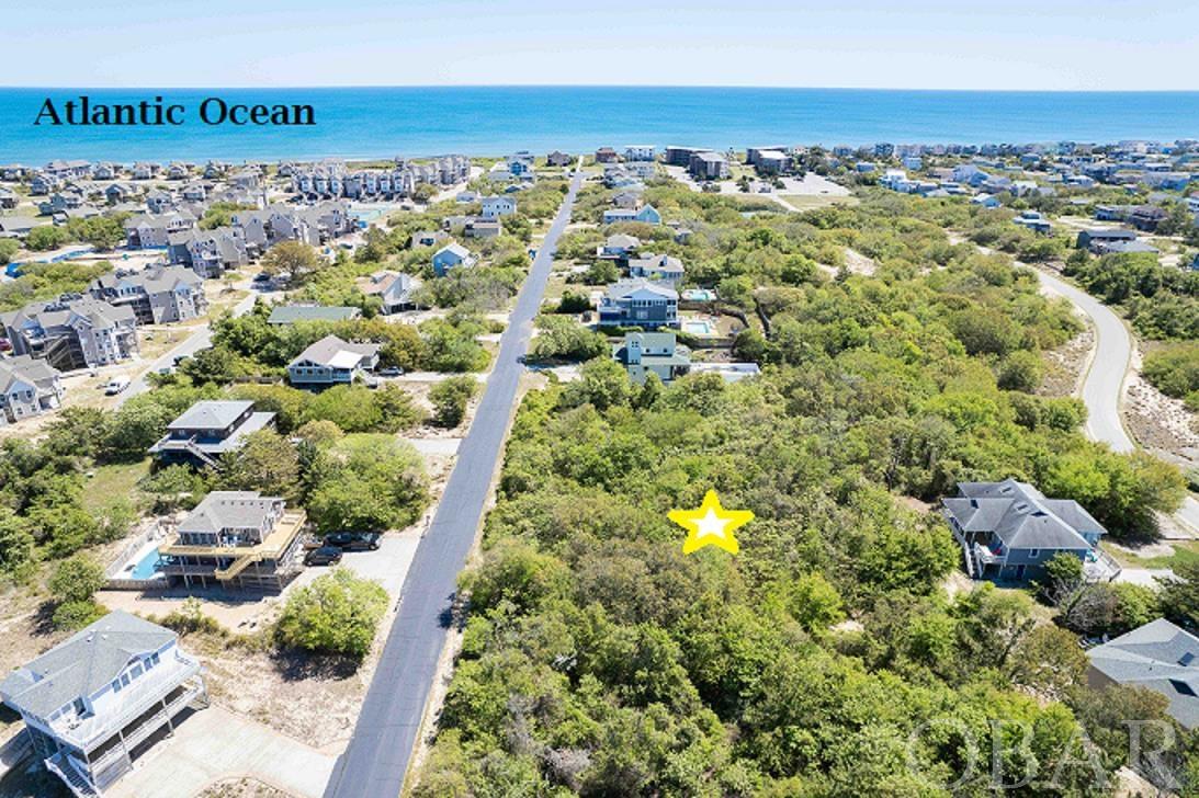 Oceanside, In-Town location, high elevation, probable sound views and a rare opportunity to custom build exactly what you want in a beach property! The "look and feel" of Olde Duck Road and its close proximity to the beach and the Town of Duck are a rare and desirable combination! Located in a X Flood Zone, means NO flood insurance needed for this homesite! Come build your dream home and enjoy all of the fantastic features the Town of Duck and this community has to offer! Proximity to the ocean, down-town and the sound-front boardwalk makes this property highly sought after! Looking for your next adventure? A short walk to town lets you experience all of the wonderful waterfront shops, restaurants, watersport rentals, and much more. This area is great for walking, jogging, and bike rides! AND of course, sunbathing!  Imagine waking up in this wonderful neighborhood and enjoying everything this beautiful area has to offer, within easy reach of your custom-built home! No need to wait any longer for that “perfect” house to be listed, build your dream now! Call us for more info, then act quickly to secure your future on this prime lot!