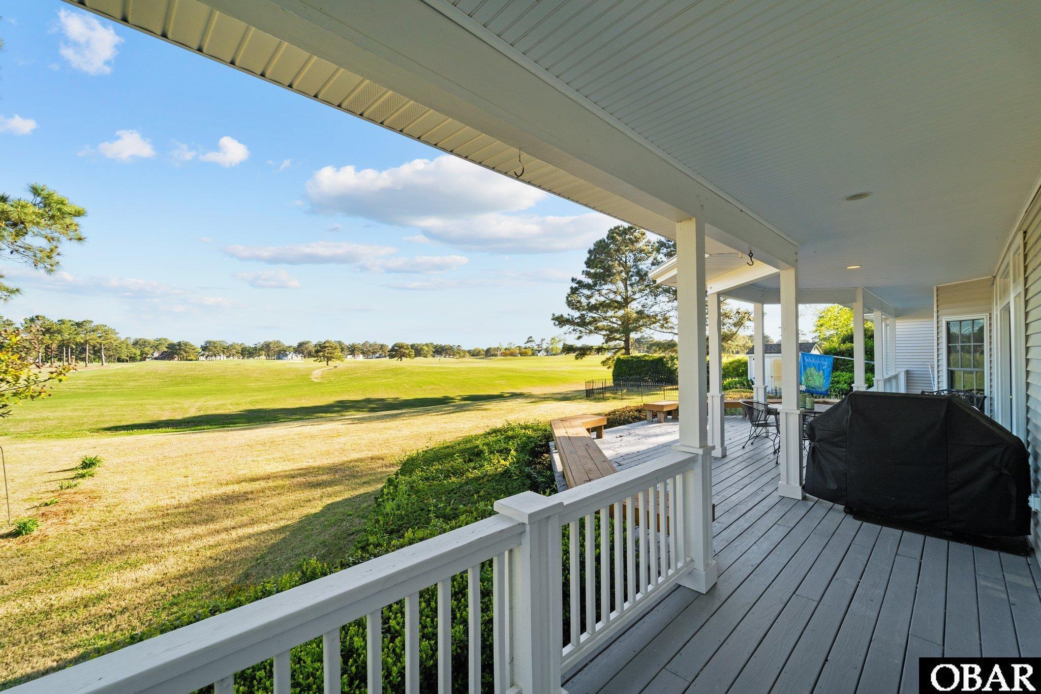 Covered porch overlooking the golf course