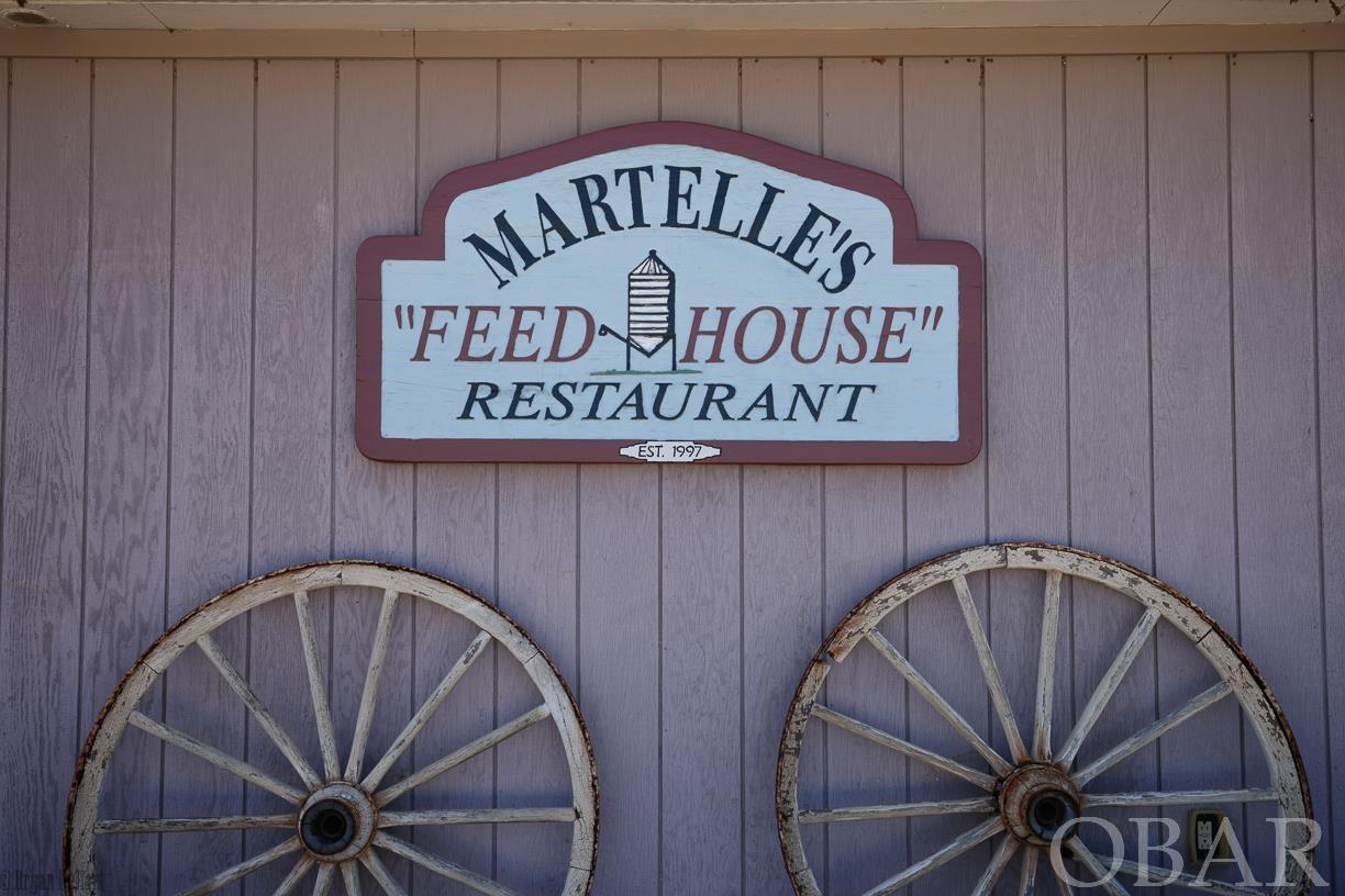 Martelle's Feed House is for sale! What an amazing opportunity to own this iconic profitable restaurant located in the coastal North Carolina town of Engelhard which is in Hyde County. Martelle's was established in 1997 as a BBQ restaurant and catering business. Because of it's success an expansion took place in 2003 bringing the seating from 40 to over 150 and creating the popular oyster bar. The menu was expanded as well and there are quite a few folks that'll tell you that the Martelle's Feed House is their favorite restaurant in the whole state. Locals and tourists alike will regularly make the trip from the Outer Banks, which is less than an hour away, to dine here. Beef, pork, fresh seafood and fresh seasonal vegetables are what keep folks coming back. It doesn't matter what color your collar is, everybody is the same at Martelle's. The atmosphere in the main dining room is highlighted by antiques acquired from old local country stores and artwork reflecting the major industries of this coastal county... farming, hunting and fishing. The oyster bar has a sports bar feel with bar seating at the 16' L shaped custom bar,  the 4' tall raised bar tables and chairs, big screen TVs but with a healthy dose of the county's waterfowling heritage. In this social media age, there are endless possibilities for this venue. I've heard someone mention the possibility of converting it into a high end hunting lodge for fall and winter and a corporate retreat for spring and summer. At almost 7000 heated square feet, with county water and sewer, a large fully functional and fully equipped commercial kitchen, the bar, the 640# ice maker and the 8'x16' walk in cooler...that's not a bad idea. A comprehensive equipment list can be found in the Property Documents section of the listing. Don't miss this opportunity. Showings and financials are available for qualified buyers.