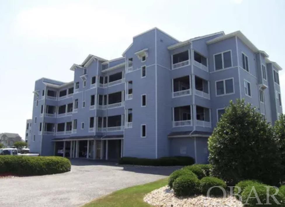 TOP FLOOR, MARINAFRONT CONDO with Covered Reserved Parking! Features include two full bedrooms, 1 bonus bedroom or office space, two full baths, cathedral ceilings in the living area, an eat on bar, and a covered deck with views of the Roanoke Sound and the Marina. Comes FURNISHED.  Located in the heart of all the activities on the Pirate's Cove docks and close proximity to the Marina. Pirate's Cove amenities include: two pools, a clubhouse, playground, tennis courts, lighted walking docks, and a fitness center.