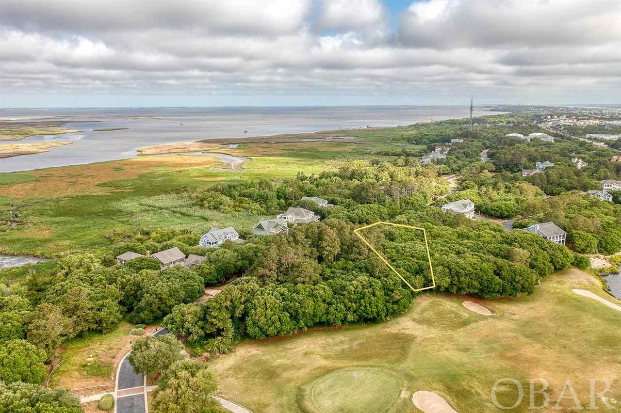 Experience The OBX  lifestyle. Prime Building  lot is located The Currituck Club .Builders packages available. Almost a half acre  Lot That Backs Up To The Golf Course On The 14th Fairway*. Could Have Sound Views From Second Story Home.  Some of the amenities that The Currituck Club provides  are The fitness center is the hub of all the activities for the club. This gated community features world-class Rees Jones 18-hole golf course, clubhouse, fitness center, community pools, bike paths, pedestrian paths, tennis courts, volleyball court, basketball courts, and trolley service to the beach. Guests of the Currituck Club enjoy discounted greens fees and preferred tee times. Also The Mid-Currituck Bridge is a proposed 7-mile long two-lane toll bridge that will span across Currituck Sound, connecting US 158 and NC 12.Call to see today Gated community. bring an offer! Gated community an  agent must be present to show.