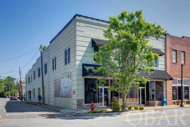 Turn Key Restaurant with additional upstairs space in Columbia, NC!  This building features a 4,528 sq ft restaurant downstairs, with an additional 4,528 sq ft upstairs that could possibly be renovated for residential use, office space, or additional commercial use.  New roof in 2022, HVAC replaced in 2017.  The restaurant has everything in place and seating for over 120 patrons.  Centrally positioned in the middle of the dining area is a beautifully finished wooden horseshoe bar with over 40 seats.  Behind the bar you will find several coolers, a 6 tap kegerator, multiple sinks, 2 wine coolers,  ample cabinet storage and shelving, and more!   This dining area surrounds the bar on all sides, with roughly 20 tables that can accommodate an additional 80+ customers.  Table tops are a finished wood as well matching the bar top.  Plates, glassware, silverware, and all cookware is included.  Fronting Main Street, there are several large bay windows and two entrance doors. Finished pine flooring is found throughout the dining area.  The dining area also features a rustic coastal decor and original brick walls.  Bathrooms have been recently updated.   The large kitchen has all the necessary equipment in place including 2 deep fryers, steam tables, updated hood system, and much more. There is a large prep area and ample storage areas as well.    The upstairs 4524 square feet was previously finished for residential use.  While it is currently being used for storage, there is a ton of potential for the creative buyer for this space.  Possibilities include residential use, office space, or large event area.   Showings are by appointment only and only to qualified buyers.