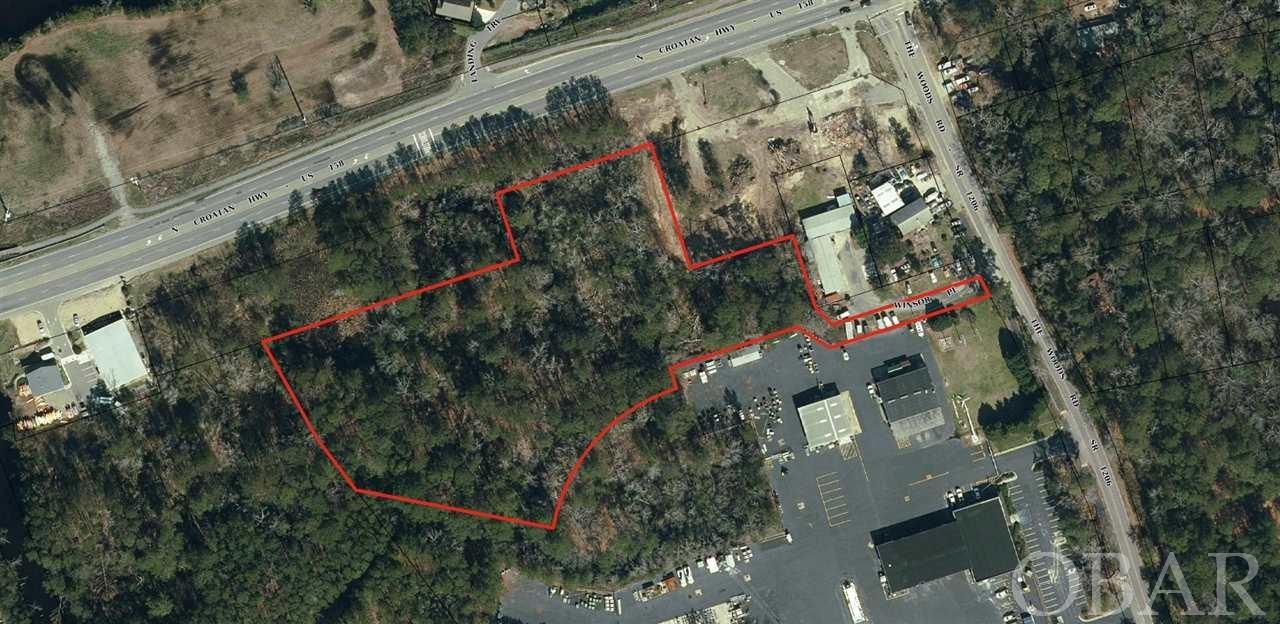 Approximately five acres of commercial property adjacent and west of the new 7 Eleven at the corner of US 158 and Woods Road with access from US 158 already in place with access from Woods Road as well. The property is part of a Planned Commercial Development which allows for many uses. The property is zoned BC-2 (Beach Commercial Two) which also allows all uses in (BC-1) Beach Commercial One plus Beach Commercial Two. The property is currently approved for 14 units per acre multi-family.  The property consists of approximately 5 acres, of which 2 acres are ACOE Jurisdictional Wetlands, however there is an existing ACOE permit to fill 1.33 acres of the jurisdictional wetlands.  This property is located at he entrance to the Outer Banks and has the highest traffic flow in Dare County. This property is of proximity to Walmart, Home Depot, OBX Chevrolet, Harris Teeter, Food Lion and numerous Banking Institutions.