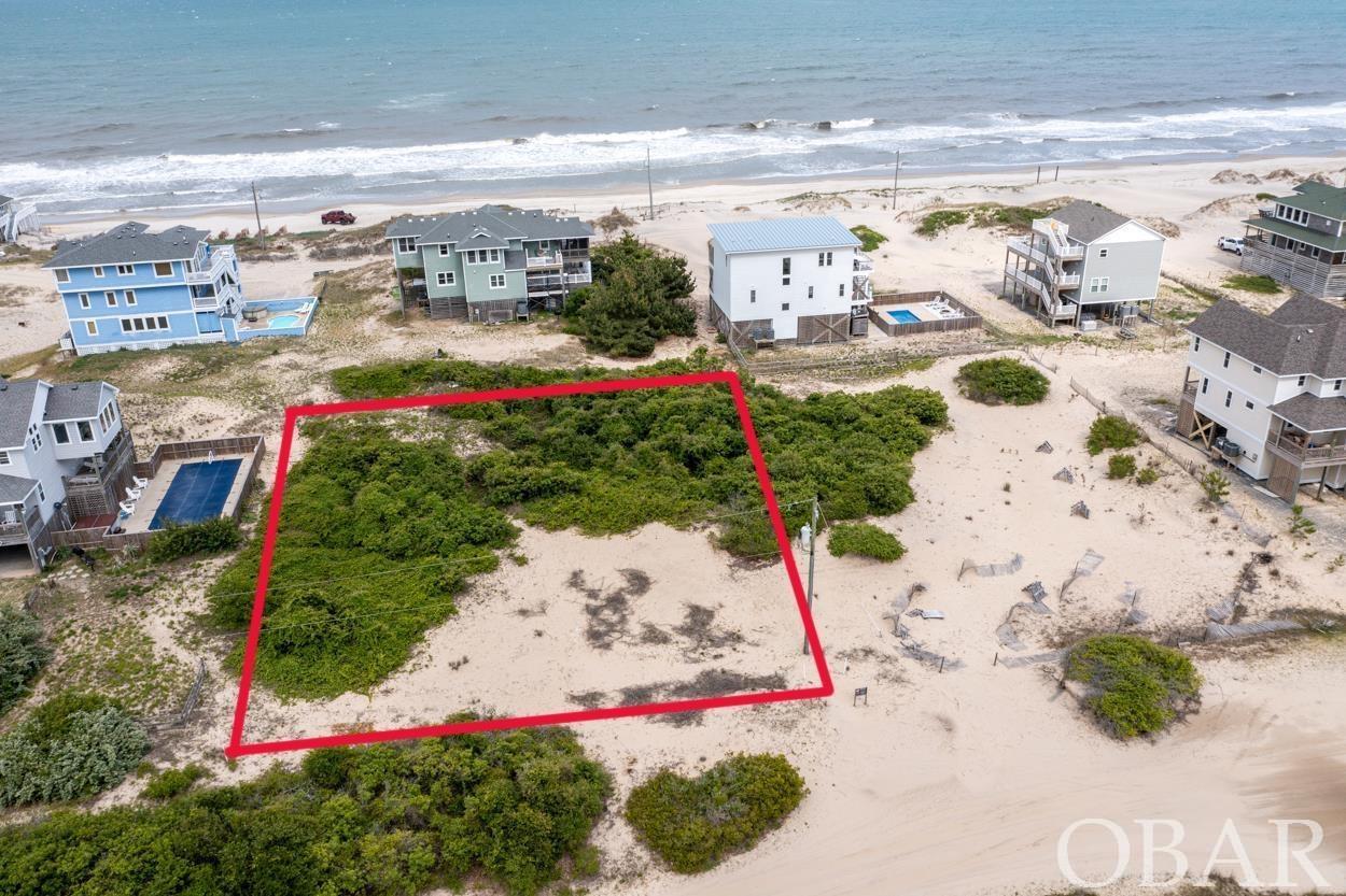 Beautiful 3rd row lot in Swan Beach. Approximately 3 miles from the paved roads. Your future home should have great ocean views. Come build your beach dream home in the 4x4 area of Corolla. Enjoy the roaming wild Mustangs and the Atlantic ocean. Owner financing available.
