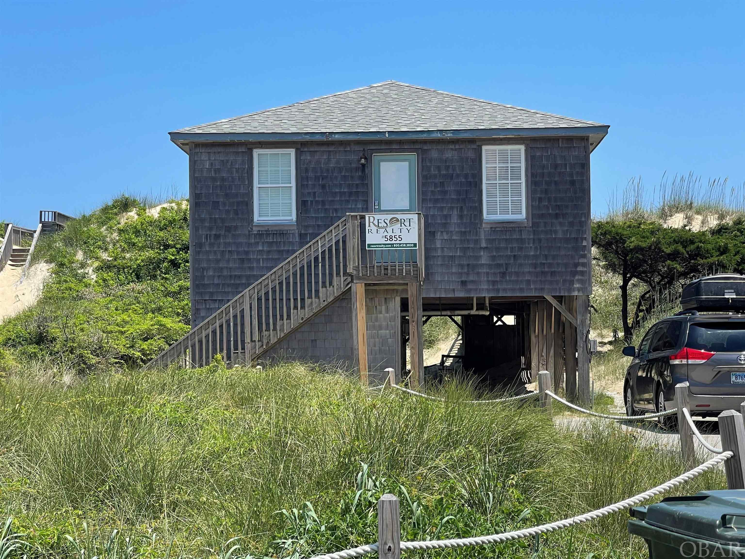 Great, ocean to road, South Nags Head property with beach box style home and a large dune. The property is ideally located at mile post 19 a little more than 1 mile south of the Outer Banks Pier which has one of the best oceanfront restaurant/bars. This 4-bedroom, 2-bath with bonus living/game room was beautifully remodeled in the last three years.  Renovations include, but are not limited to, new cedar shake siding on the entirety of the exterior of the home, new showers, toilets sinks and vanities in both bathrooms, all new appliances in the kitchen with new quartz countertops, new mattresses and furniture in all bedrooms, new flooring throughout, completely new HVAC system and new paint throughout the interior. With a well-established income in both the offseason (through AirBnb) and in season (through Resort Realty) this home offers the perfect opportunity for a vacation home investment. Come and see it for yourself.   Rental Income estimates vary from firm to firm and may include money that does not go to the owner, such as cleaning fees, administrative charges or services. Buyers are encouraged to investigate how rates, fees, commissions, regulations and policies apply to specific properties before expiration of the due diligence period. It is the buyer's responsibility to determine and execute a rental management contract that best suits their needs. VRBO, Air BnB and similar rent by owner websites are handled differently. Consult legal counsel regarding rental disbursement. Additionally, the Buyer is advised to check on any short-term rental restrictions.