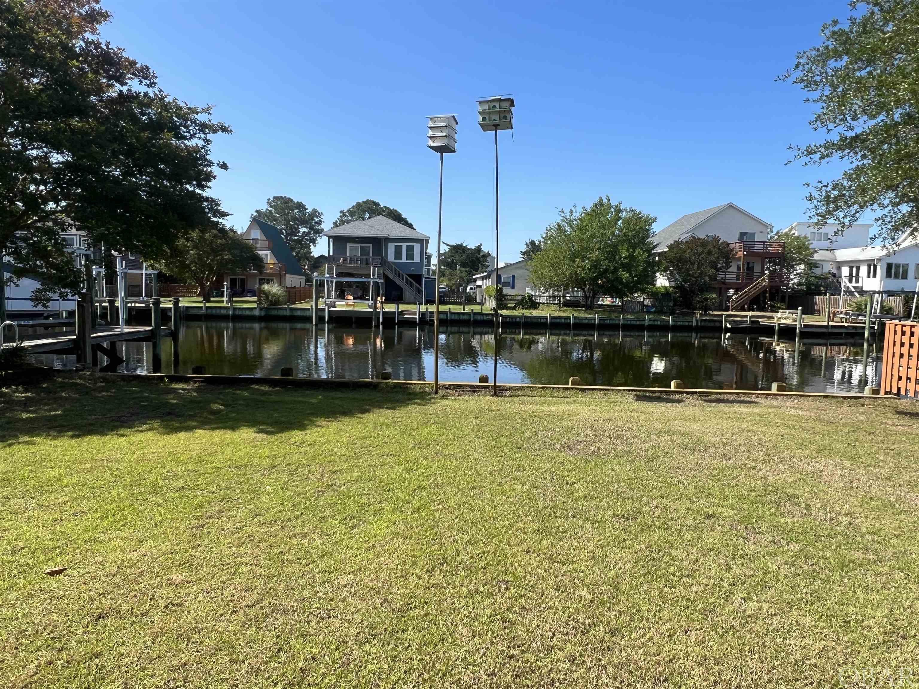 Wonderful CANALFRONT building site in boating community of Colington Harbour!  44 feet of BULKHEADED DEEP WATER CANAL FRONTAGE ON WIDE CANAL!  LEVEL & CLEAR WITH FILL ADDED!  Build your dream home and enjoy fabulous views of Corsair Inlet!  PRIME waterfront location w/southern exposure & easy access to the Albemarle Sound by boat!  The sellers added several truck loads of fill when they purchased!