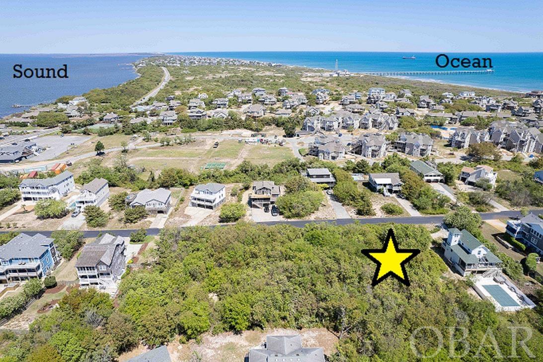 Oceanside, In-Town location, high elevation, probable sound views and a rare opportunity to custom build exactly what you want in a beach property! The "look and feel" of Olde Duck Road and its close proximity to the beach and the Town of Duck are a rare and desirable combination! Located in a X Flood Zone, means NO flood insurance needed for this homesite! Come build your dream home and enjoy all of the fantastic features the Town of Duck and this community has to offer! Proximity to the ocean, down-town and the sound-front boardwalk makes this property highly sought after! Looking for your next adventure? A short walk to town lets you experience all of the wonderful waterfront shops, restaurants, watersport rentals, and much more. This area is great for walking, jogging, and bike rides! AND of course, sunbathing!  Imagine waking up in this wonderful neighborhood and enjoying everything this beautiful area has to offer, within easy reach of your custom-built home! No need to wait any longer for that “perfect” house to be listed, build your dream now! Call us for more info, then act quickly to secure your future on this prime lot!