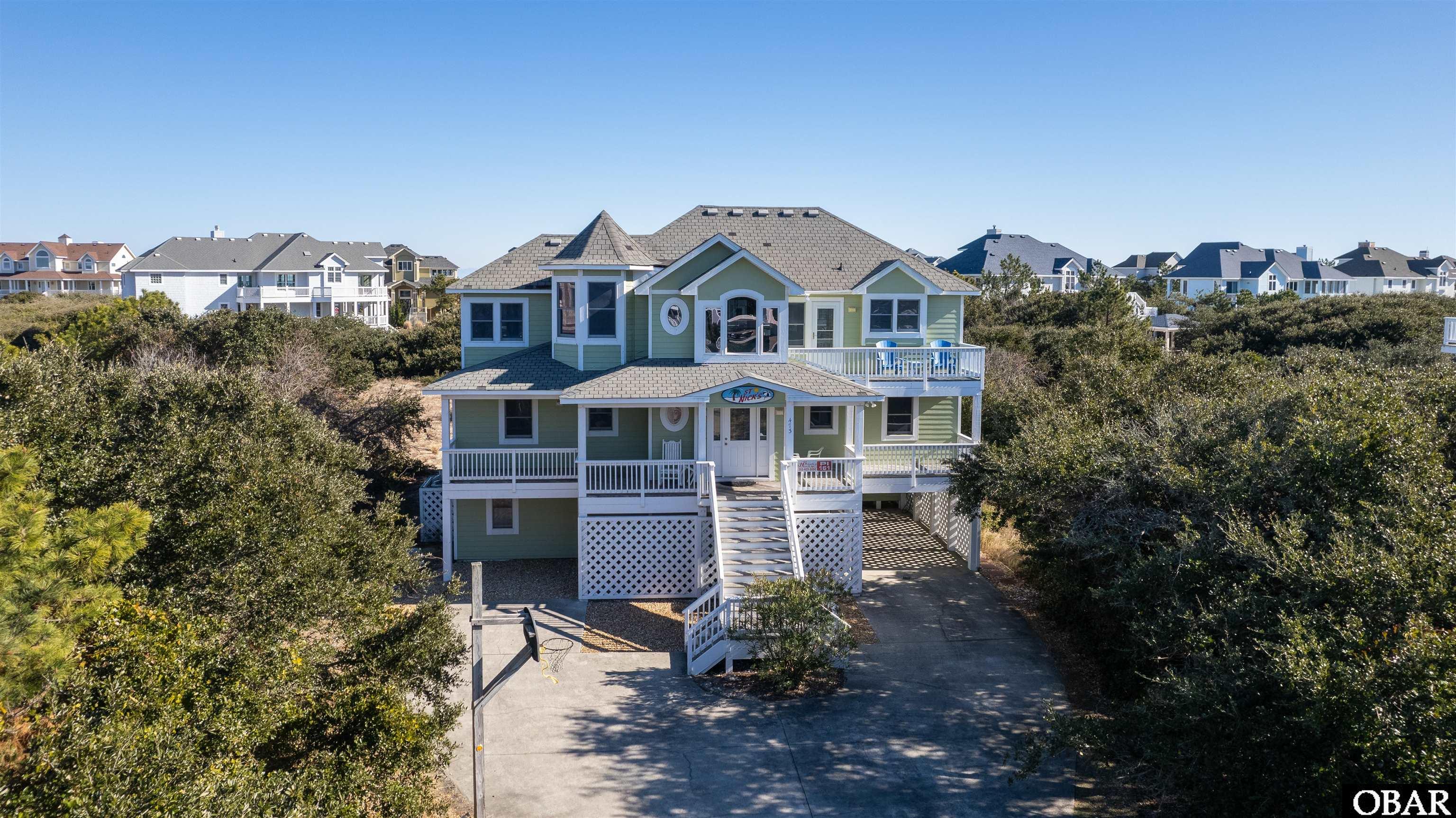 This beautiful, Pine Island home with Ocean View features 6BR, 5BA, 2 half baths.  Just a Short Walk to Beach, Community Pool, Tennis, Basketball and Playground.  Top floor has an open Great Room, Dining Room/Kitchen combination with lovely Wainscotting, Cathedral ceilings and Gas Fireplace.  Kitchen spotlights the Eye Catching Granite counter tops and Stainless Steel Appliances. Also on the top floor is a Ship's Watch with table & chairs so families can play games or just relax & read.  The Master Bedroom has a bath with Oversized Soaking Tub.  You can access the Large Sun Deck from any of the rooms and it also gives direct access to the lower levels and Large Pool Area.  Mid-Level you will find 4 Bedrooms, Laundry Area, & covered deck with Hot Tub.  Two have private baths and the two bunk rooms share a Jack & Jill bath.  Ground level has a Game/Media room with Wet Bar, Pool/Air Hockey table.  Bedroom with private bath and a half bath in Game Room area.  Outside focuses on fun with a 16' x 34' Private heated pool & Large Patio.  All New Carpeting throughout in 2021. Entire Lower Level Renovated 2017 including All Furniture, Pool/Air Hockey, Master Bed & Furniture, Both Bathrooms. Water Heater, Kitchenette, and LVT flooring.  Washer/Dryer 1 yr old. Refrigerator, Granite Island and Pool Liner all replaced in 2016. HVAC - one is 5 yrs old, the other is 8 yrs old.    The Entire Inside has been Painted, Walls & Ceilings.  Owner restricts rentals to June thru Sept.  See projection for full season rental of approx. $110,000. All the work is done, now it's Time for Fun!
