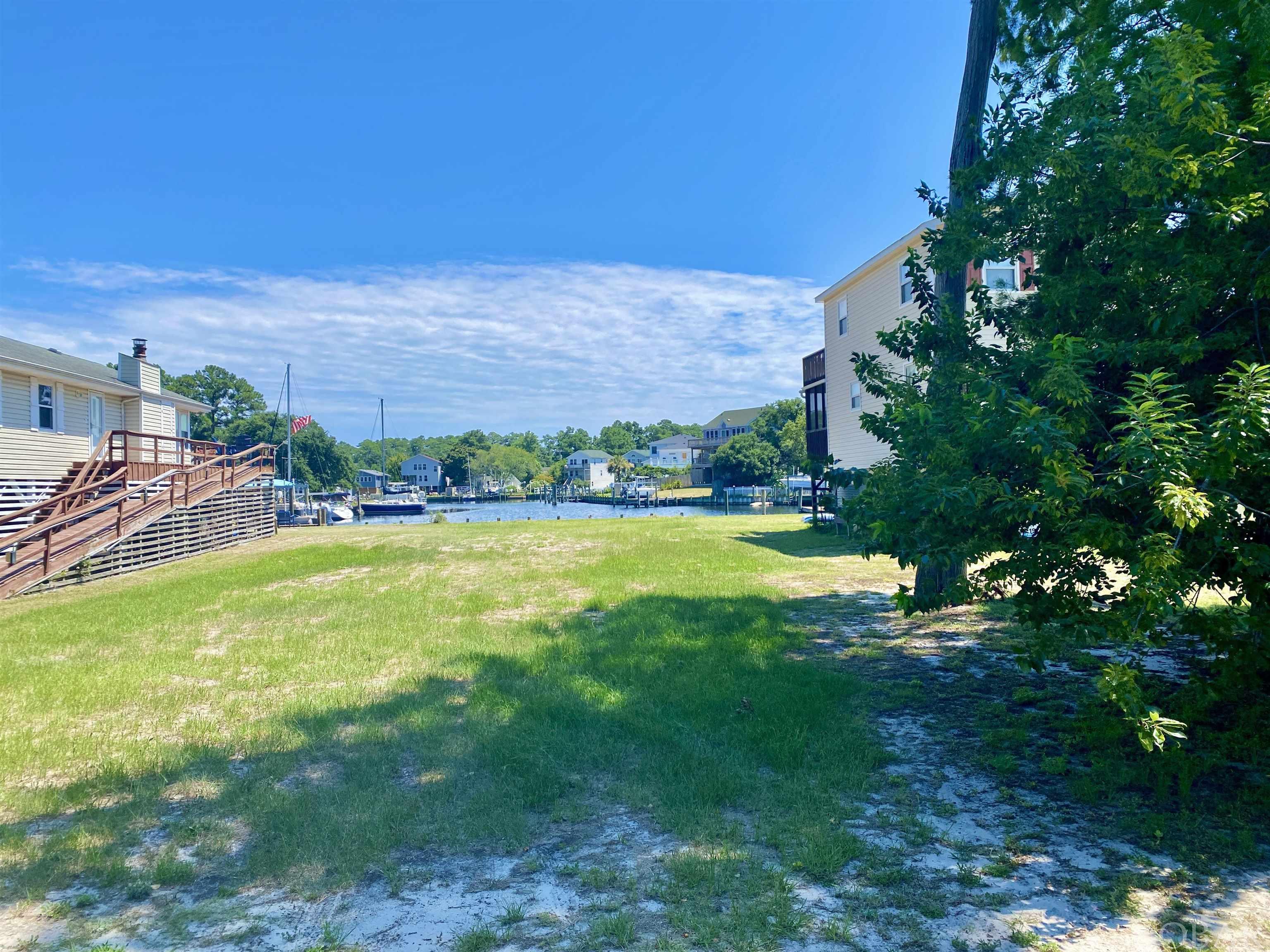 Located in the gated community of Colington Harbour, this is one of the last few Vacant Canalfront lots available. This property is already cleared  & level and ready for you to build your dream beach house. Beautiful expanded views as this lot has access to canals in three different directions.  Go Boating, Fishing, Swimming, Crabbing, Kayaking, SUP right off of your back yard.  Should have plenty of room for a pool,  boat lift & dock.  Colington Harbour offers a 24 hour security guard at the gate, a private beach, boat ramp, clubhouse, playground and picnic area. HOA fee is only $330 Per Year.  Join the Association pool for only around $200 per year.
