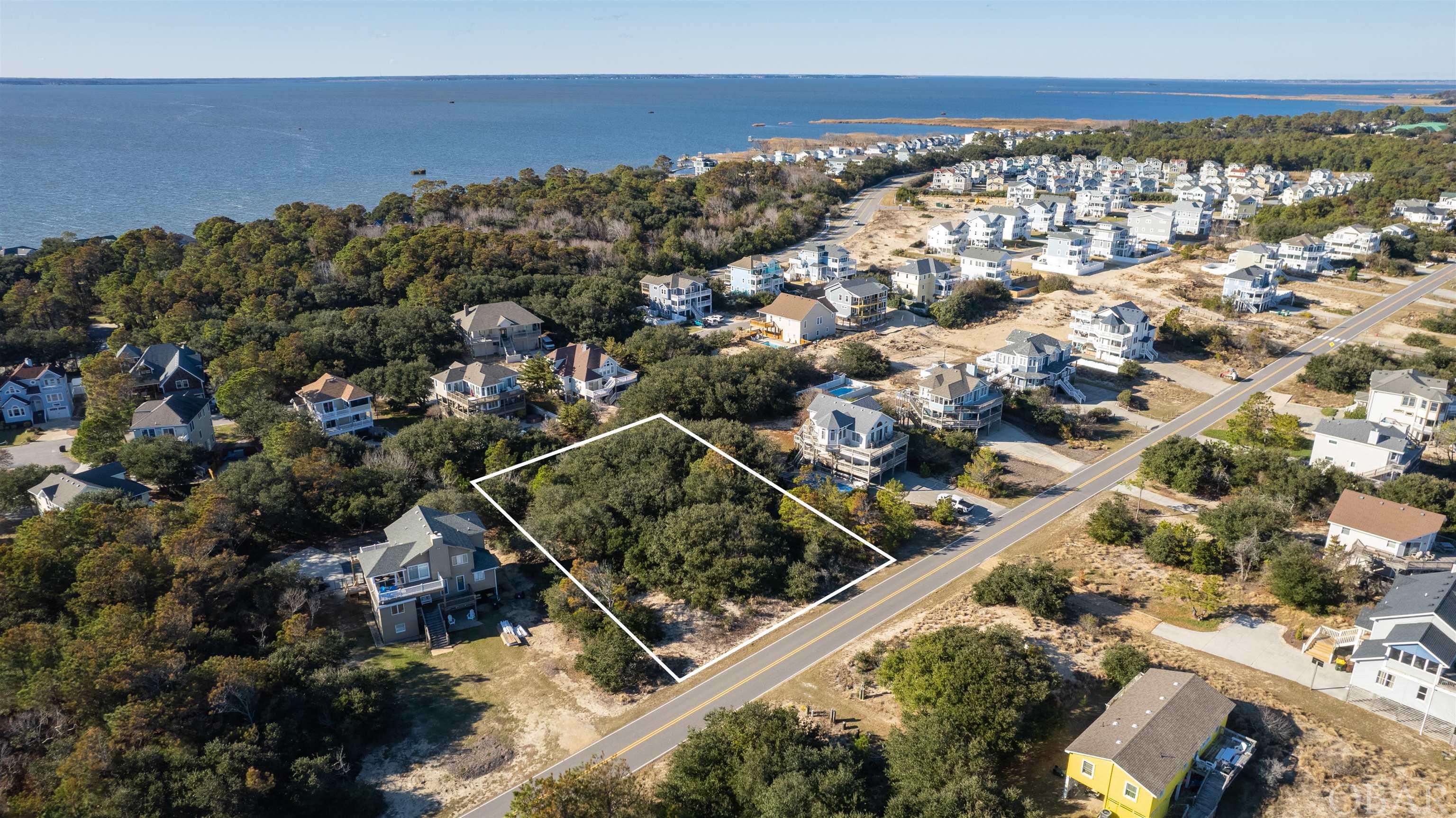 Outstanding opportunity to build your dream beach house or hold an as investment!  This 6th row homesite offers so many possibilities on the large 20,000 square foot lot.  The homesite is large enough to accommodate a generous rental home or build a modest home and enjoy the privacy of a large lot.  Short walk to the beach or bike to nearby shops and restaurants.  Whalehead is host to some of the most beautiful beaches anywhere on the Outer Banks.  No HOA fees!  Ask about the construction package option!